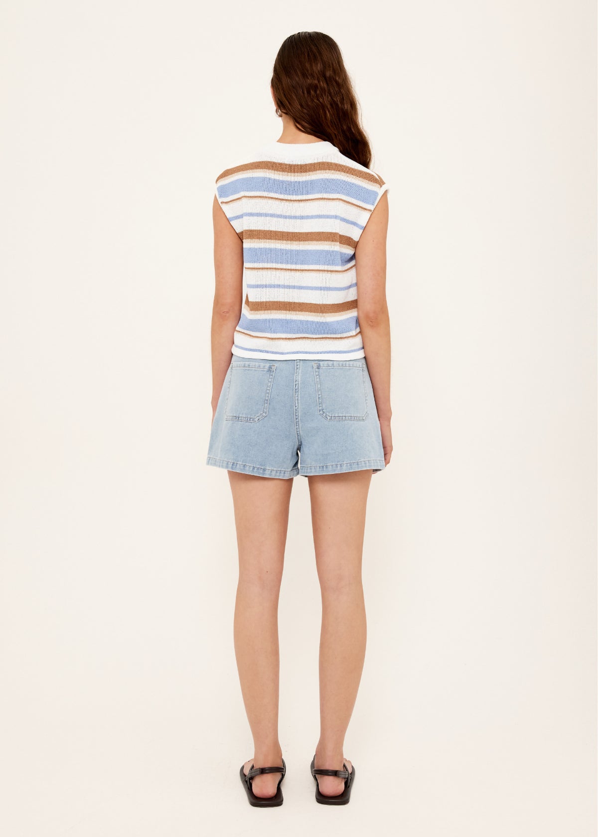 Back view of the Light Blue Denim Shorts with a zip fly and button closure.
