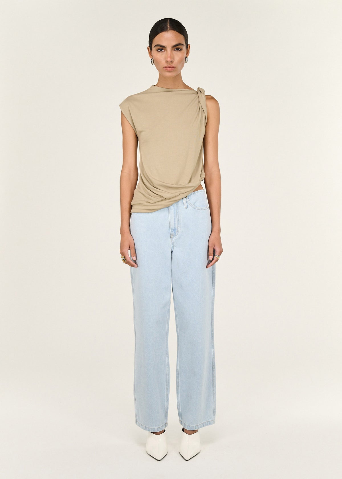 Model wearing Light Wash Straight Leg Denim Jeans with a high-rise waist and a straight leg silhouette.