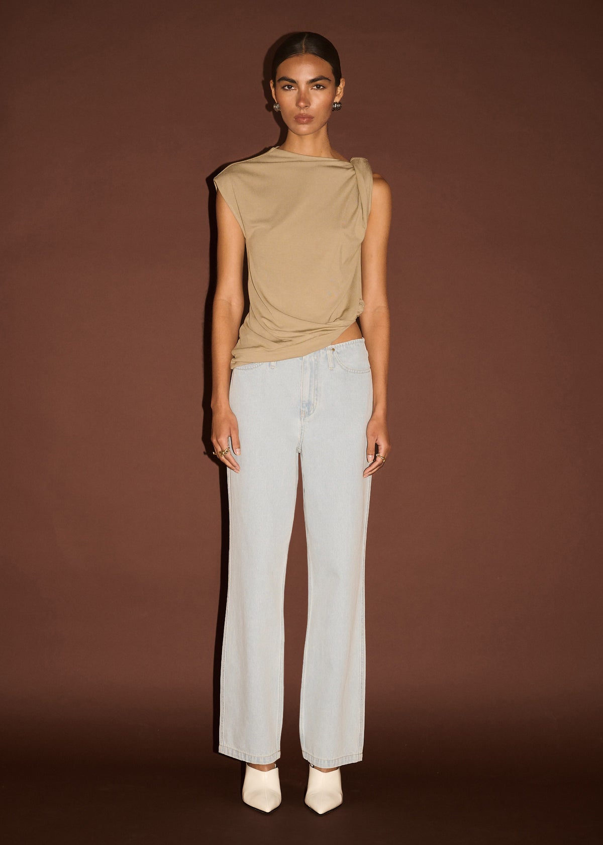 Model wearing Light Wash Straight Leg Denim Jeans, showing a full-length hem and a classic five-pocket design.
