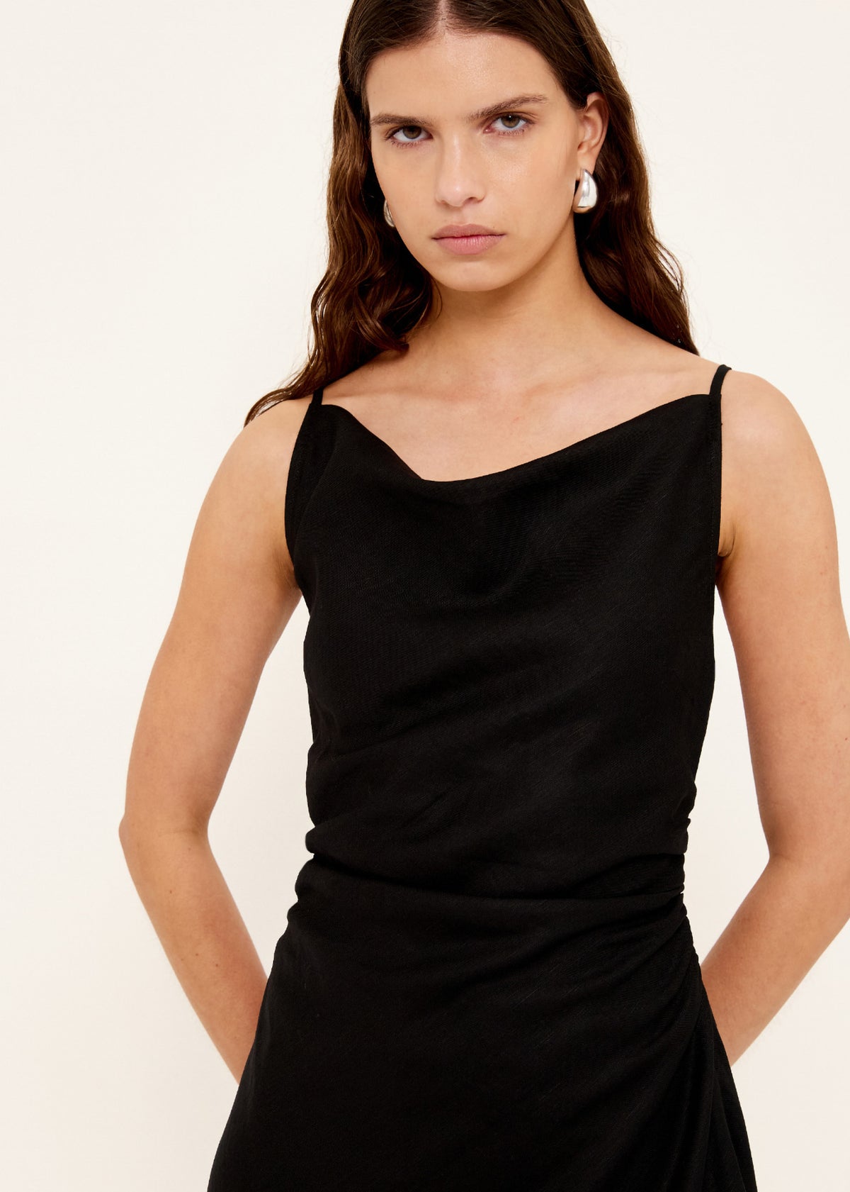 Close-up of the Linen Blend Black Bias Mini Dress, showing a cowl neckline and adjustable spaghetti straps.