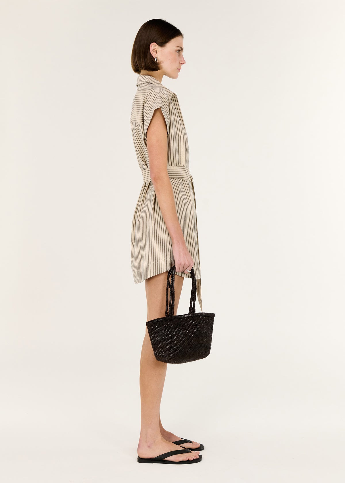 Side view of the Linen Blend Pinstripe Mini Shirt Dress, showing a classic collared neckline and a button-through front.