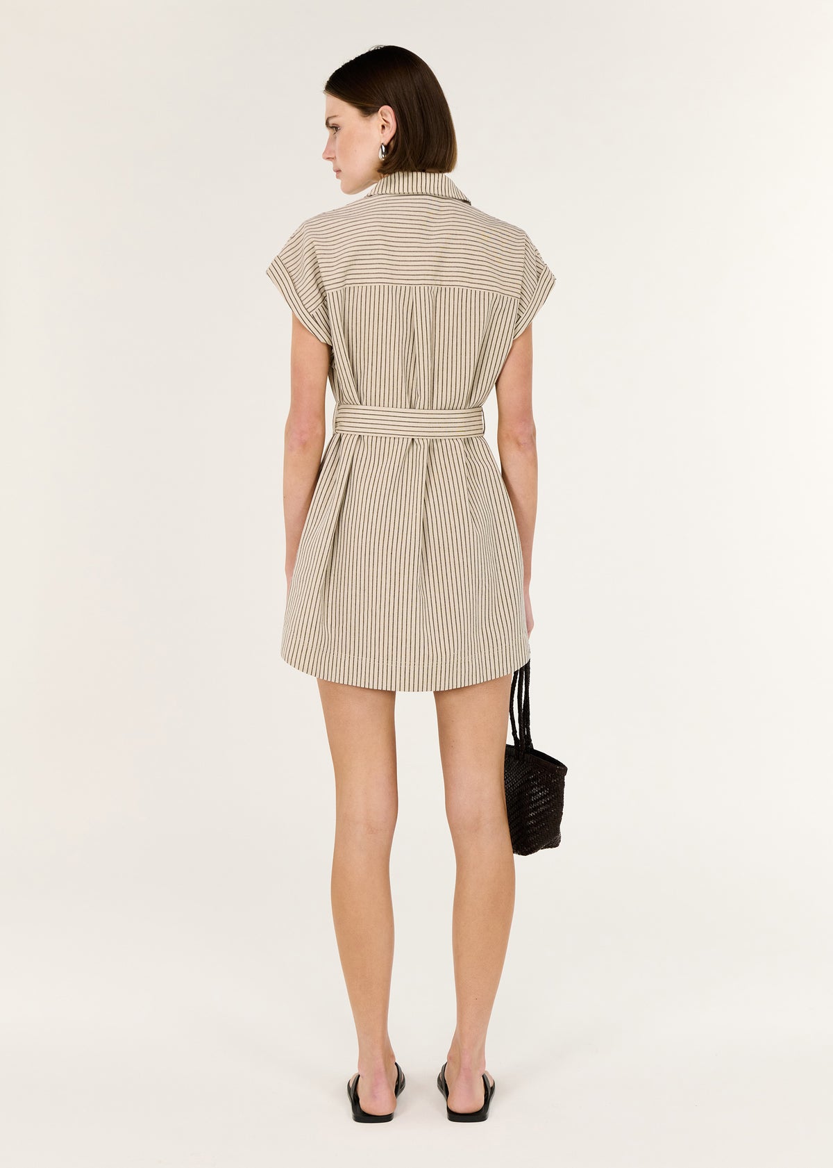 Back view of the Linen Blend Pinstripe Mini Shirt Dress with a button-through front and an adjustable self-tie waist.