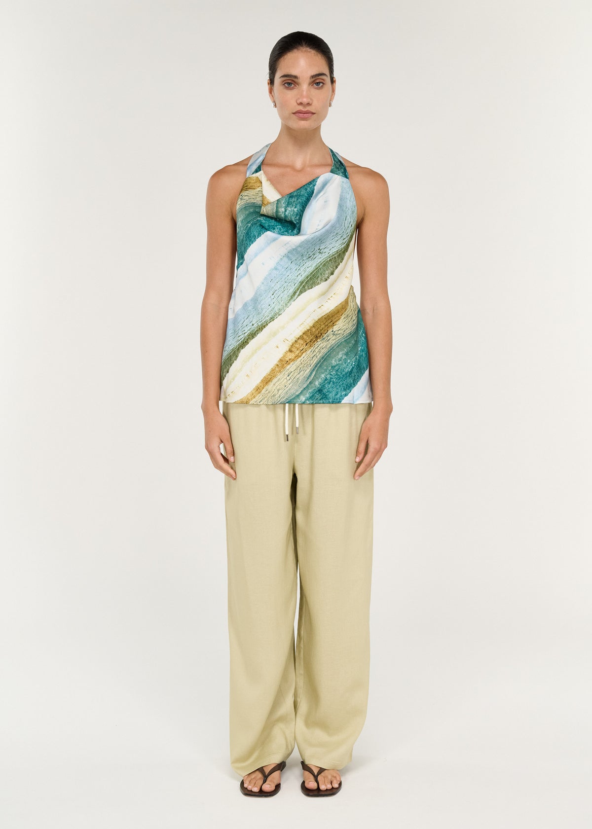 Model wearing Linen Blend Relaxed Pant in Wasabi with a colorful halter top.