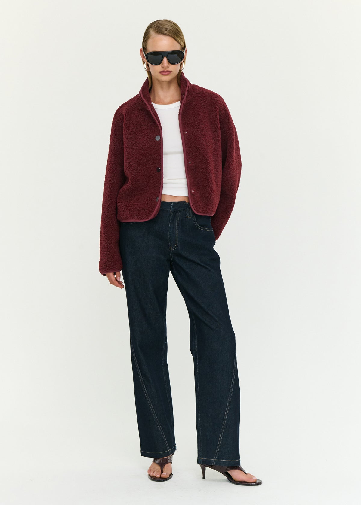 Model wearing Merlot High Neck Cropped Sherpa Jacket with long sleeves and a clean, minimal finish.