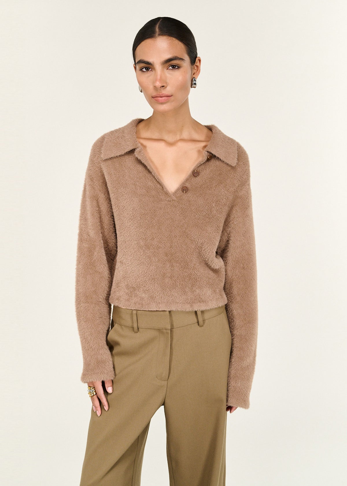 Close-up of the Mocha Fluffy Knit Polo Jumper, showing a button placket and a long sleeves with relaxed finish.