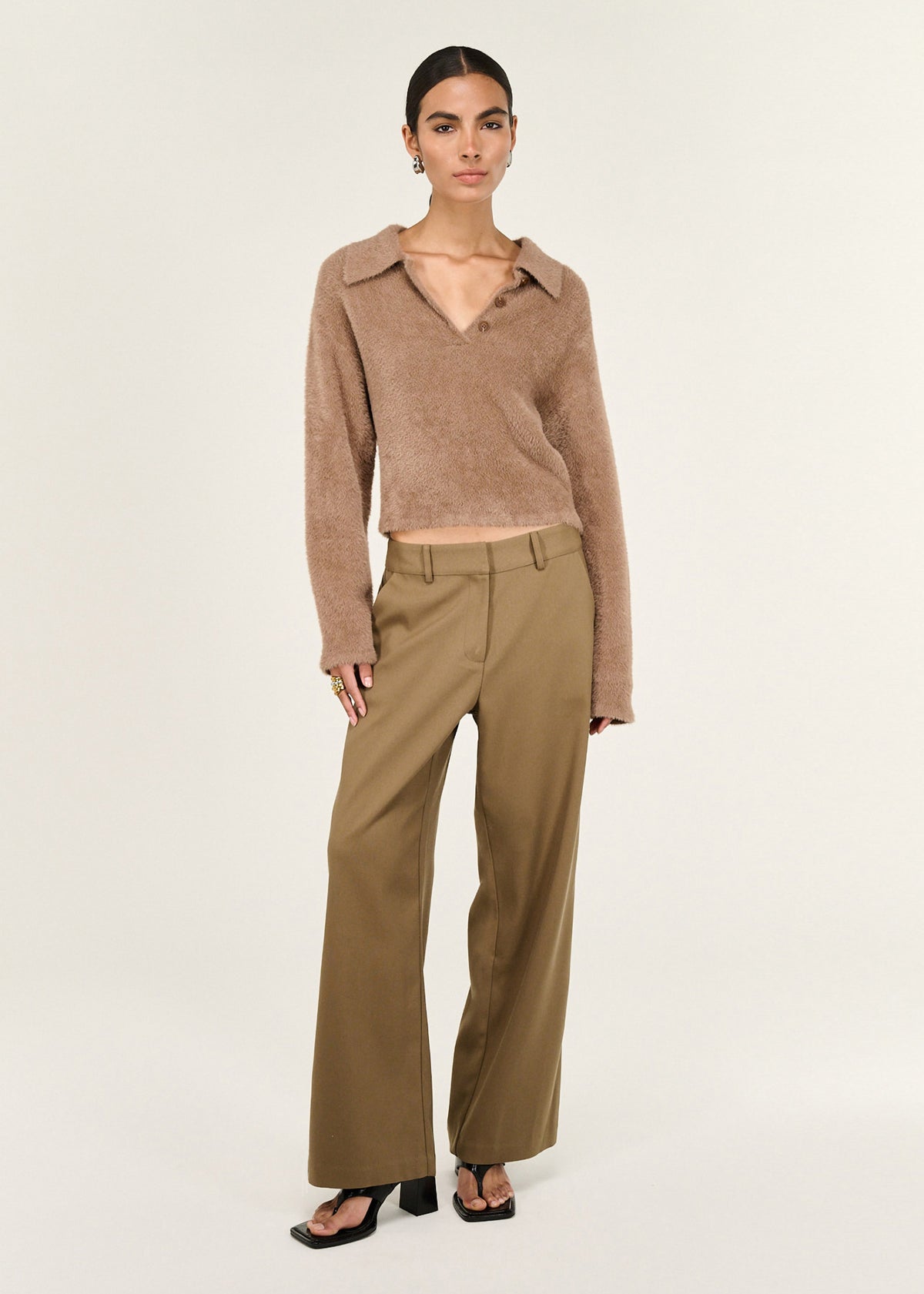 Model wearing Mocha Fluffy Knit Polo Jumper with a button placket and a long sleeves with relaxed finish.