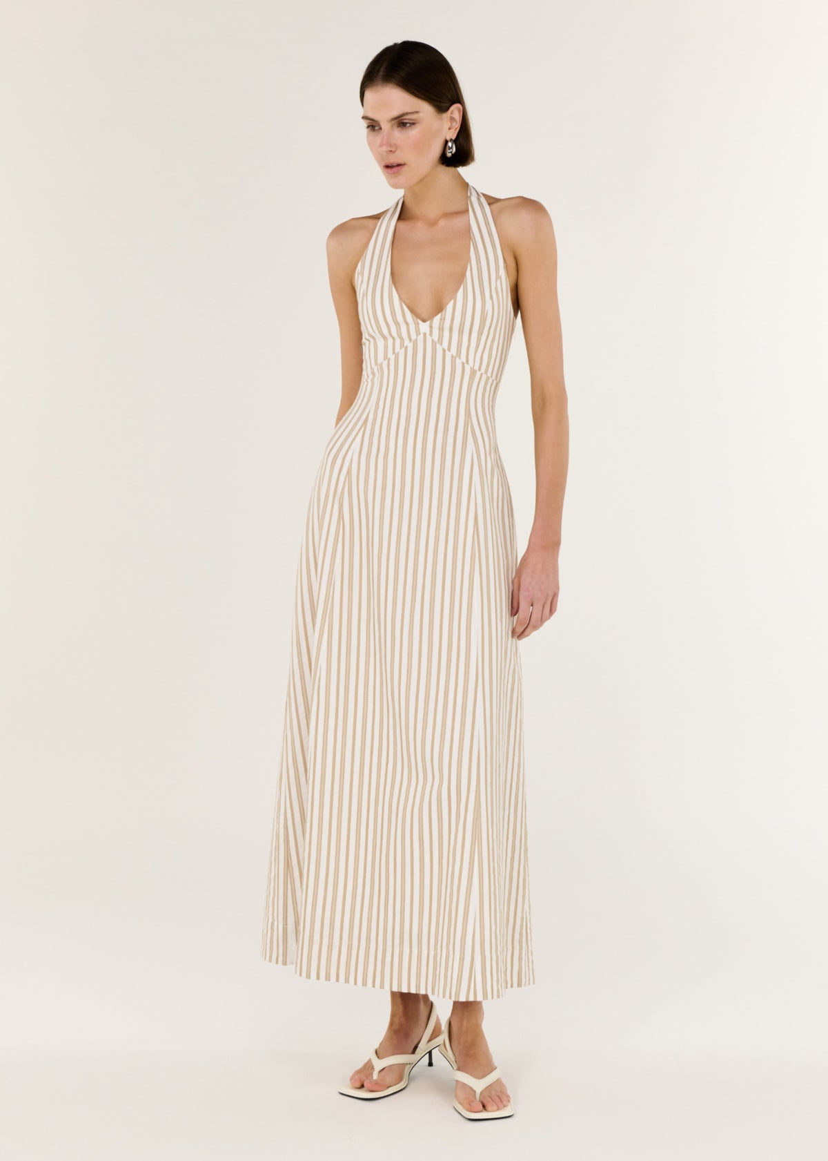 Model wearing Natural Cotton Blend Stripe V-Neck Halter Midi Dress with a halter neckline with tie back and an open back design.