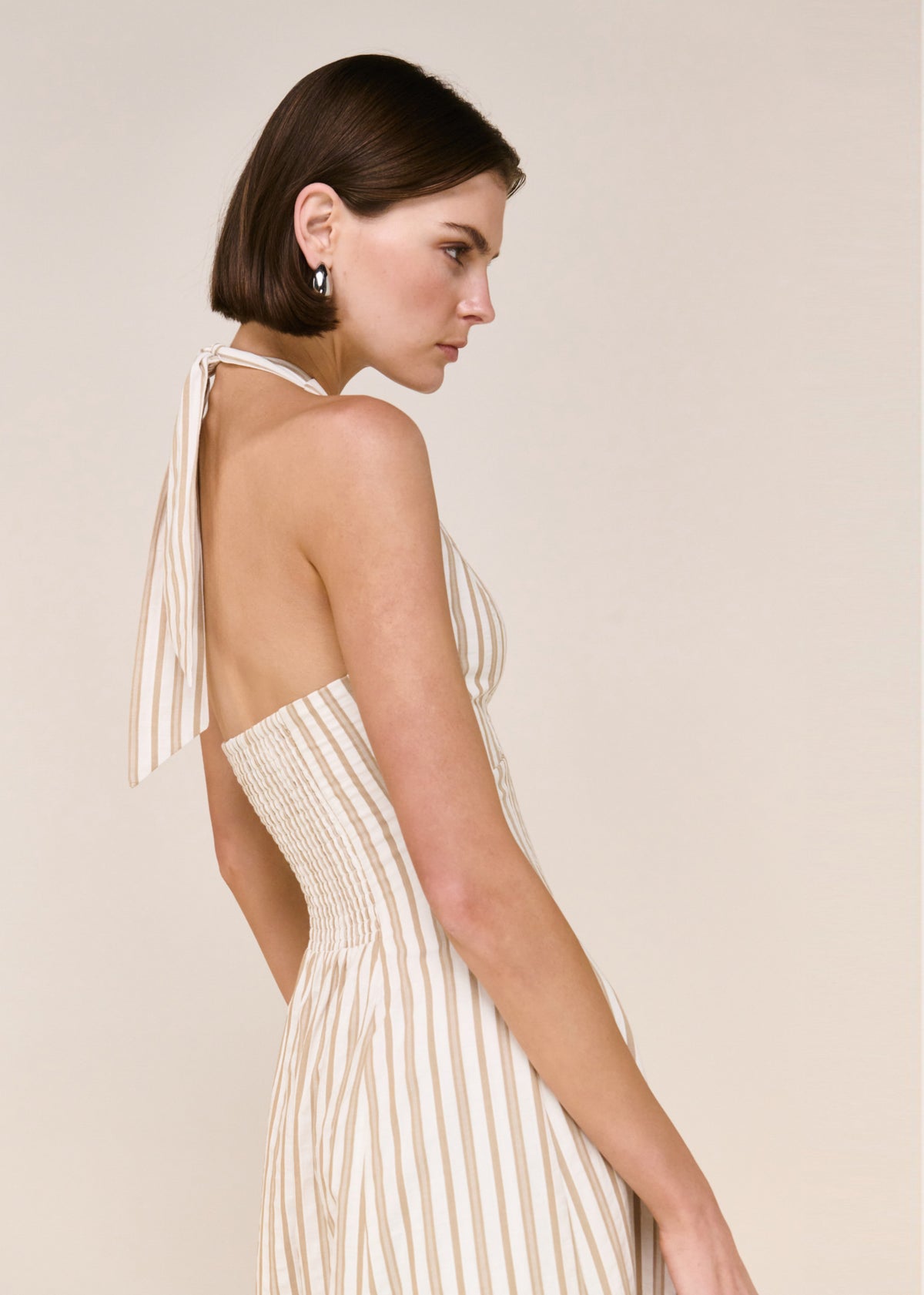 Close-up detail of the Natural Cotton Blend Stripe V-Neck Halter Midi Dress, showing open back and halter tie.