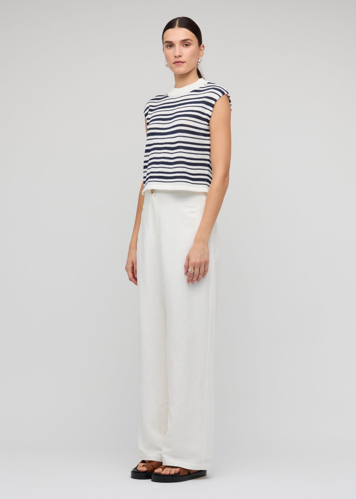 Model wearing Navy and White Stripe Knit Tank Top, showing a sleeveless tank silhouette.