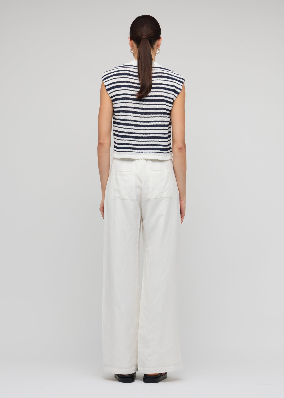Back view of the Navy and White Stripe Knit Tank Top with a sleeveless tank silhouette.
