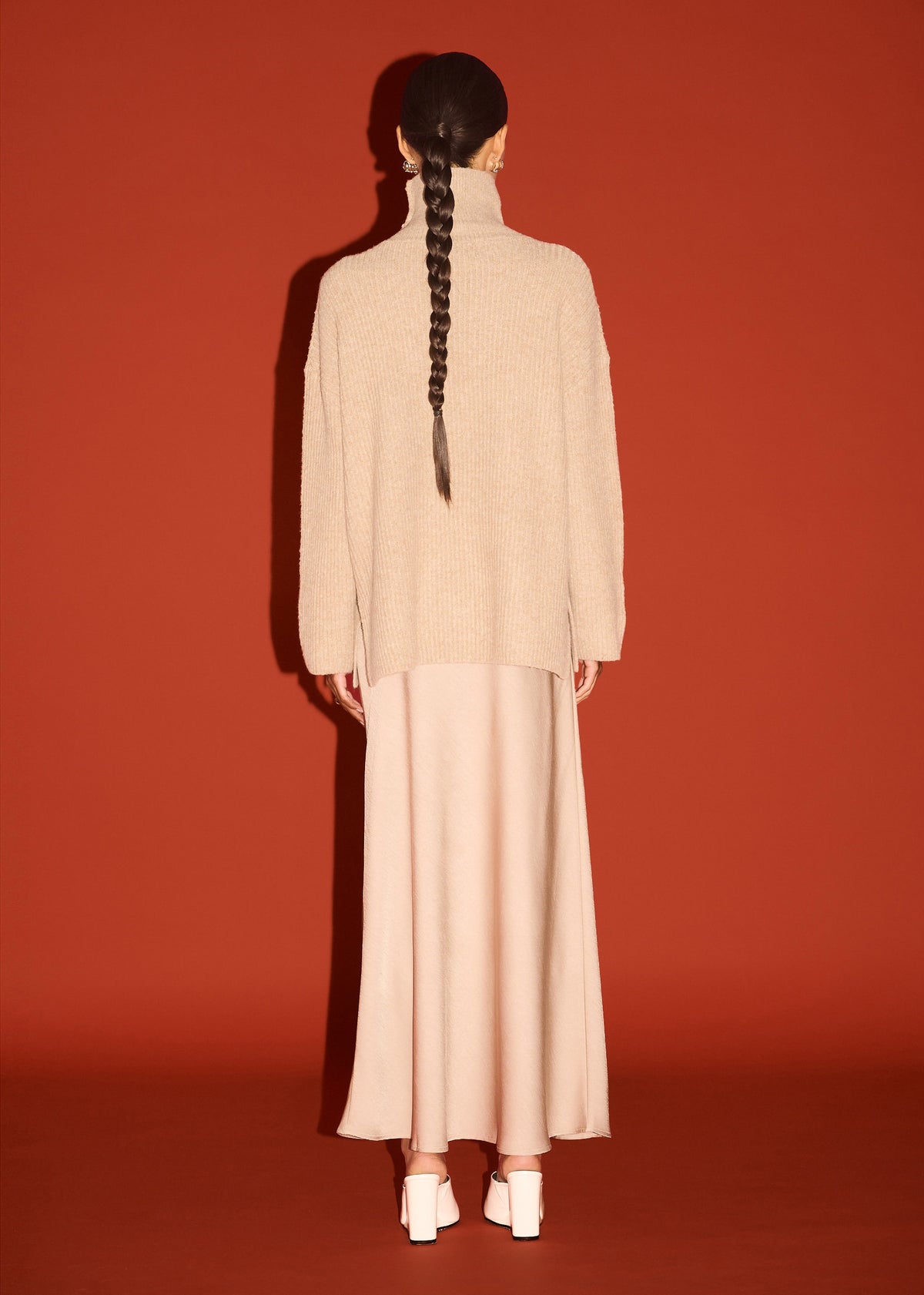 Back view of the Oatmeal Roll Neck Oversized Knit Jumper with a roll neck neckline and a relaxed fit.