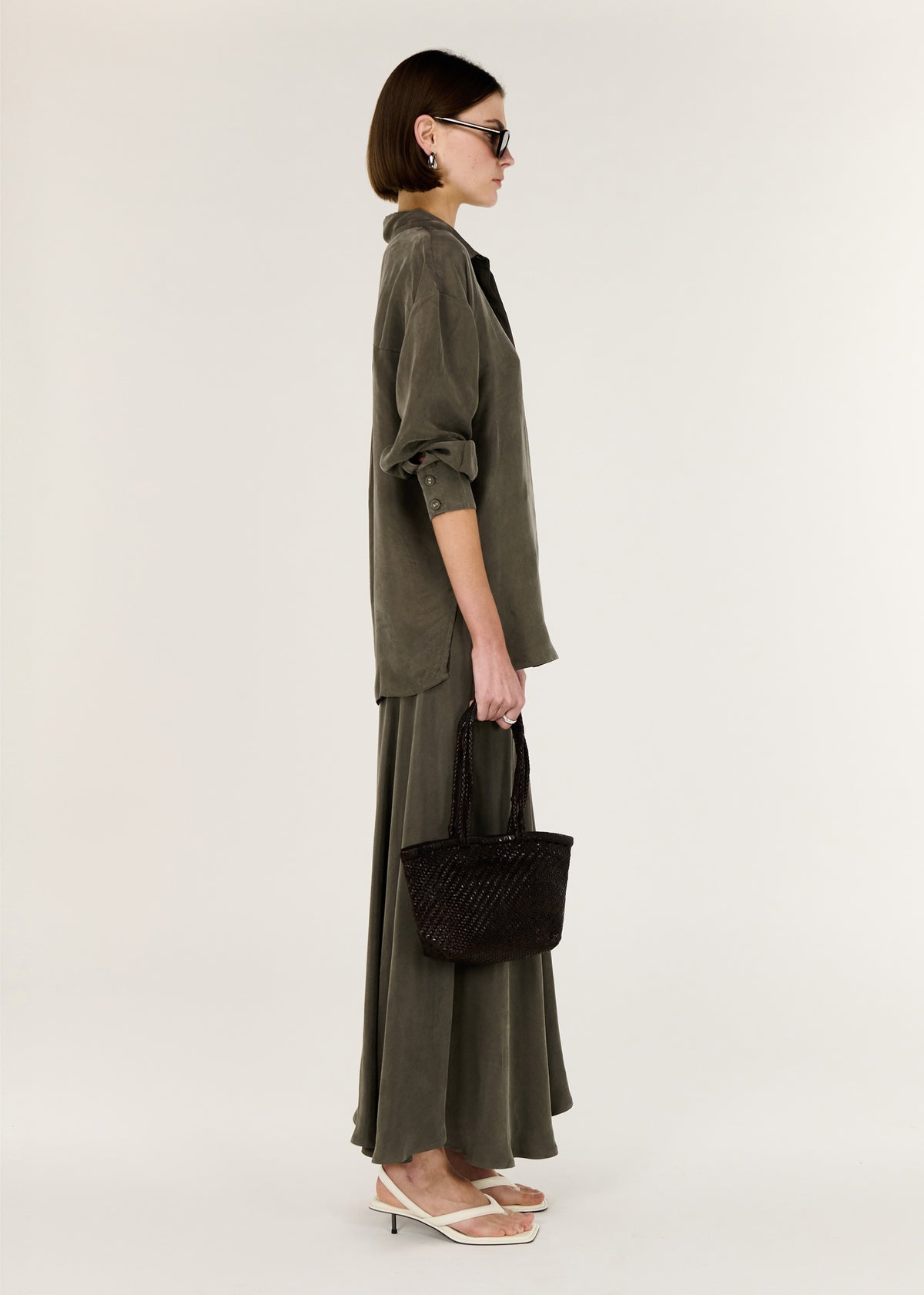 Side view of the Olive Cupro Oversized Shirt, showing a button through Front.