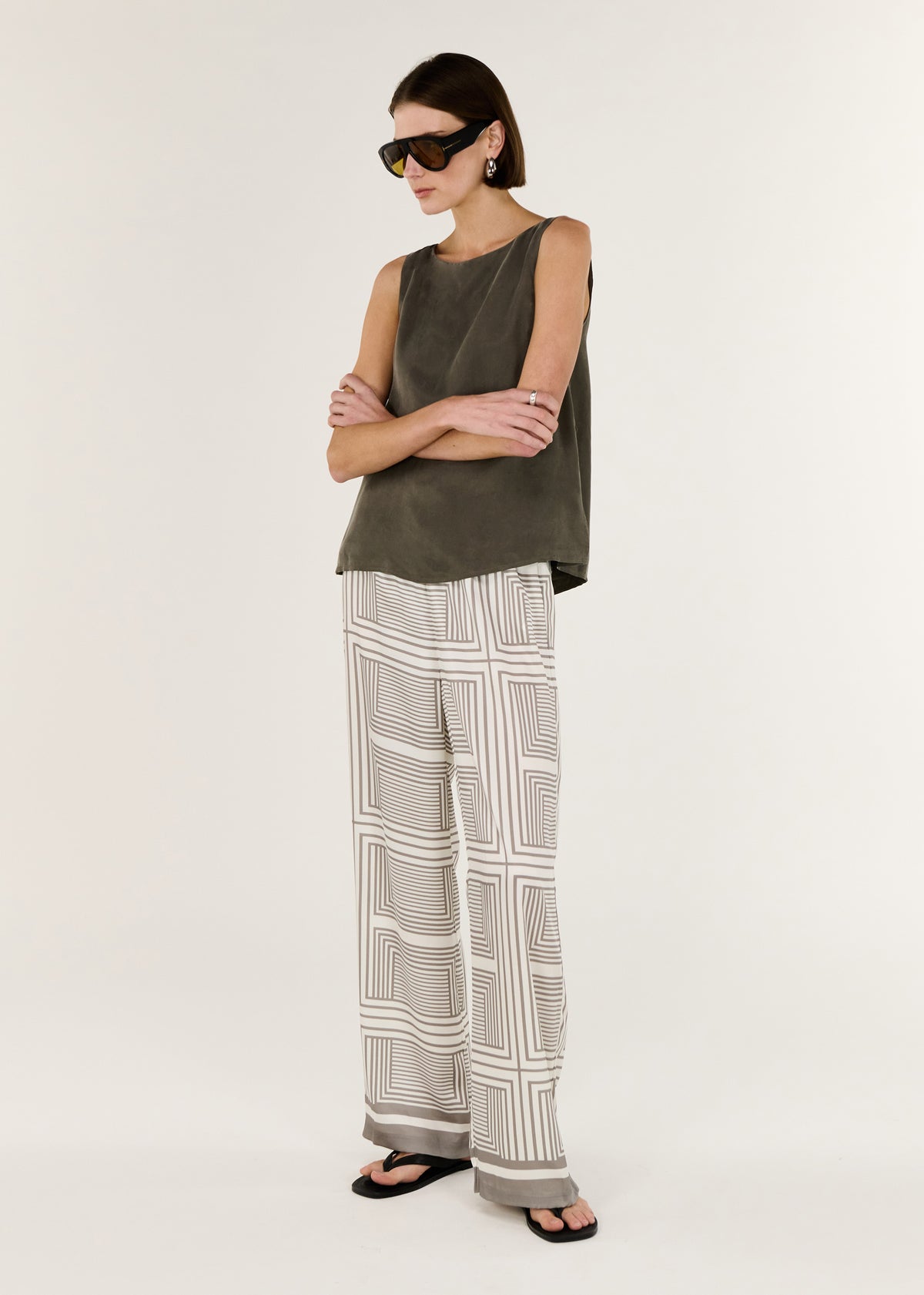 Model wearing Olive Cupro Waist Tie Tank with an adjustable waist tie and a relaxed fit through the body.