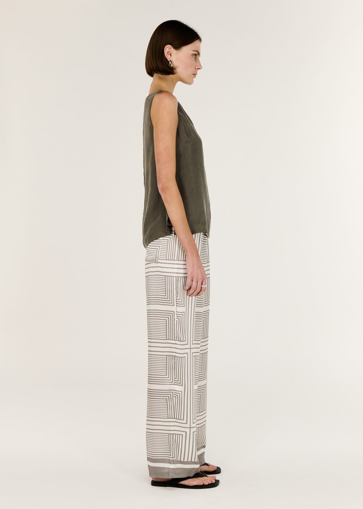 Side view of the Olive Cupro Waist Tie Tank, showing a colour: Olive and a sleeveless silhouette.