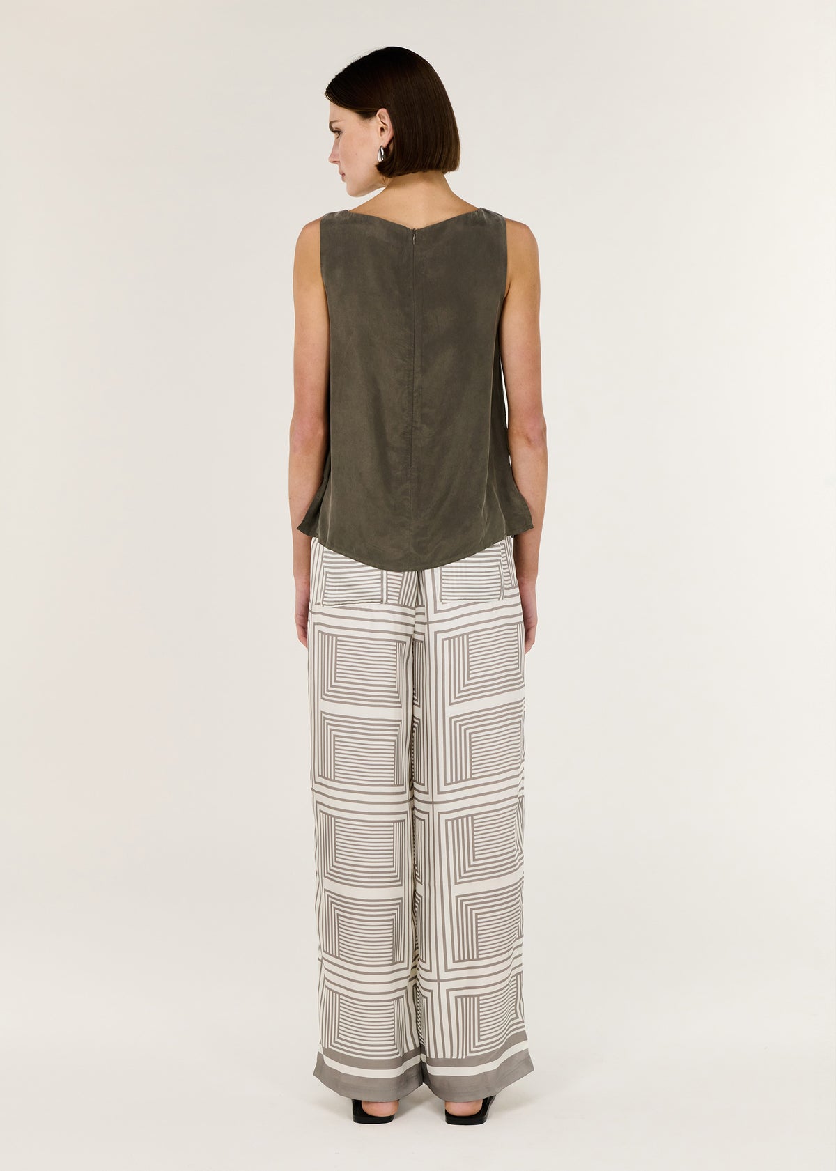 Back view of the Olive Cupro Waist Tie Tank with an adjustable waist tie and a sleeveless silhouette.