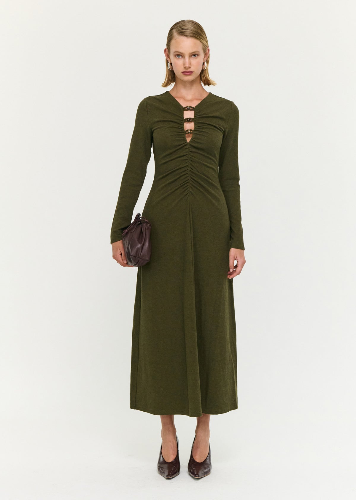 Model wearing Olive Green Bead Detail Jersey Midi Dress with a soft ribbed knit fabrication and a fitted bodice with gathered detailing.