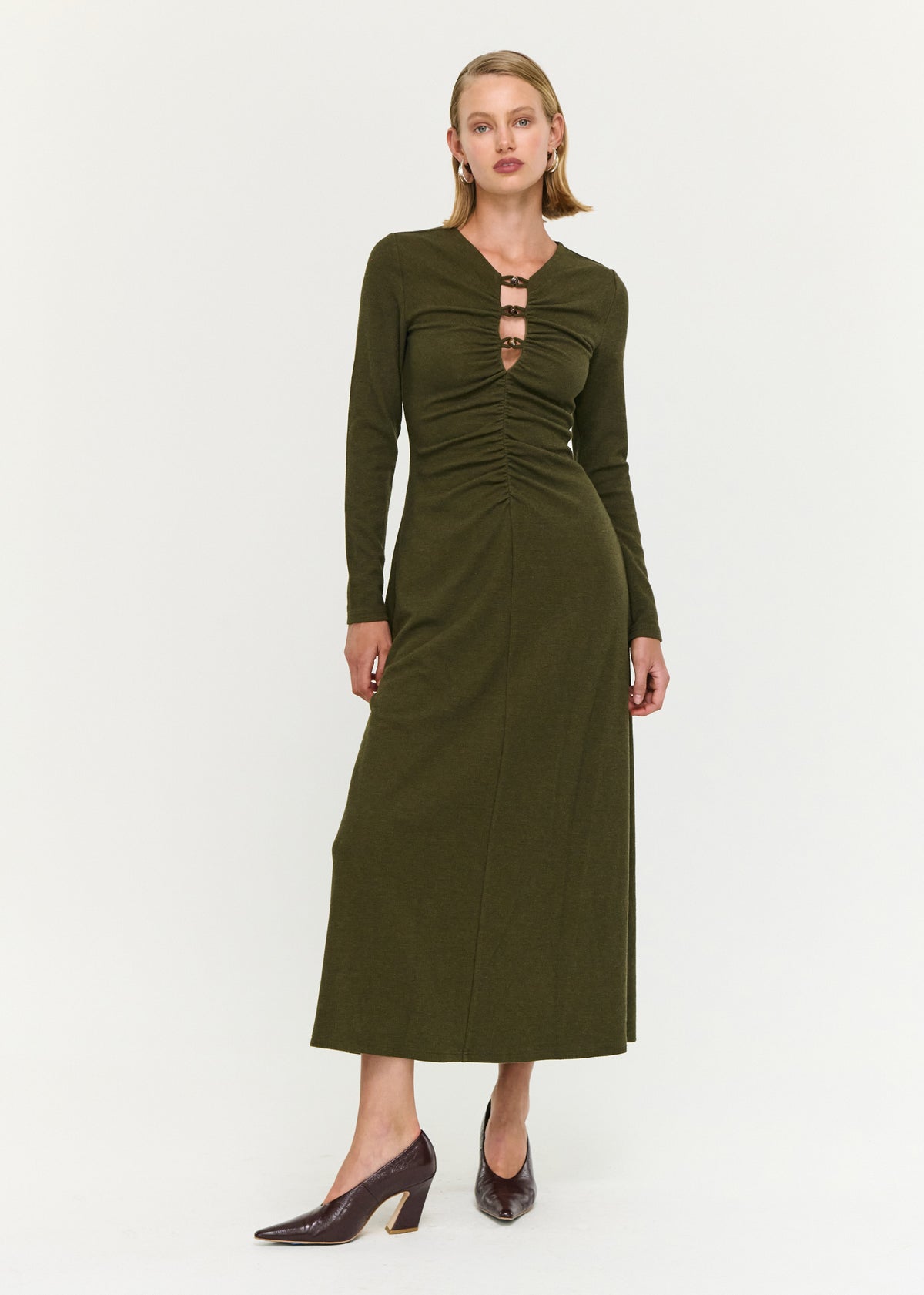 Model wearing Olive Green Bead Detail Jersey Midi Dress, showing a front cut-out feature and a v-neckline.