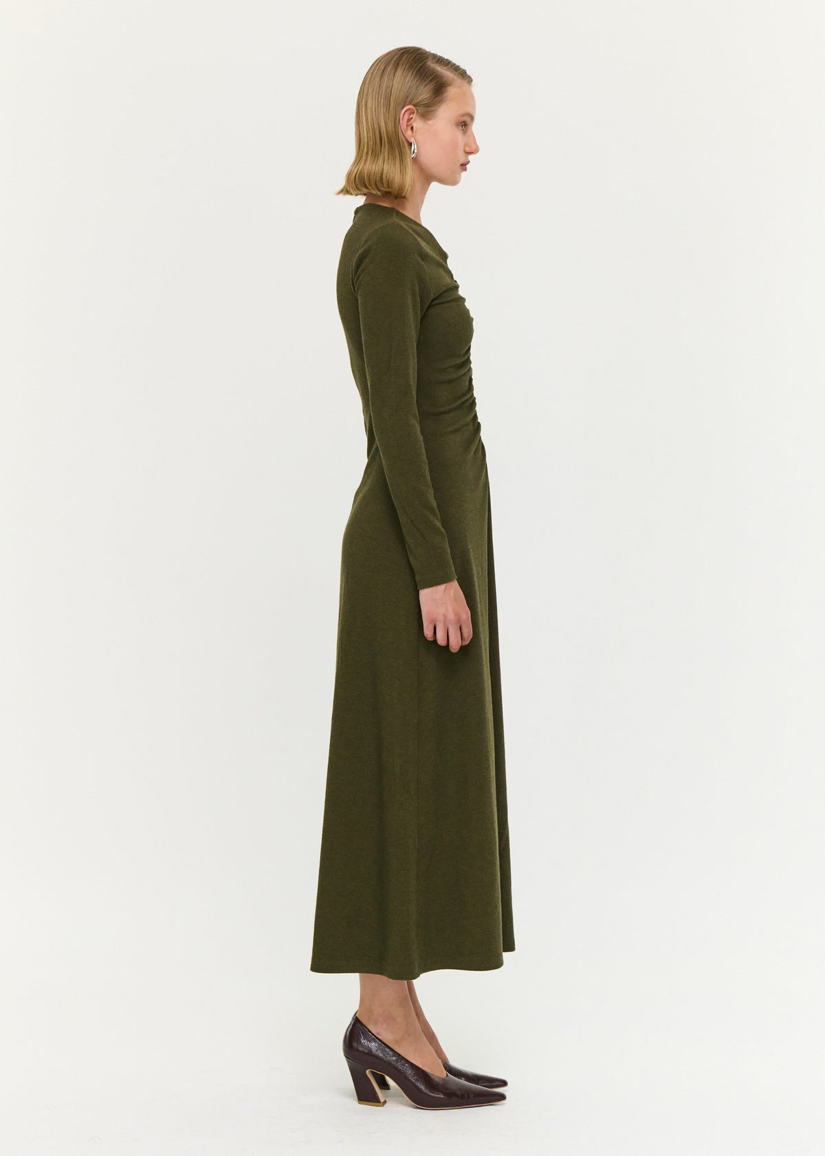 Side view of the Olive Green Bead Detail Jersey Midi Dress, showing a soft ribbed knit fabrication.
