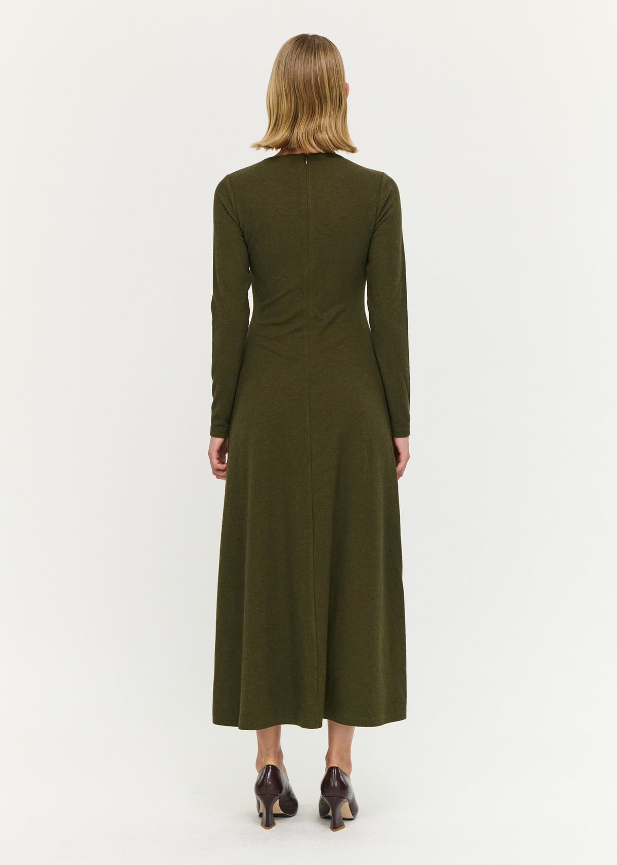 Back view of the Olive Green Bead Detail Jersey Midi Dress with a soft ribbed knit fabrication and a fitted bodice with gathered detailing.