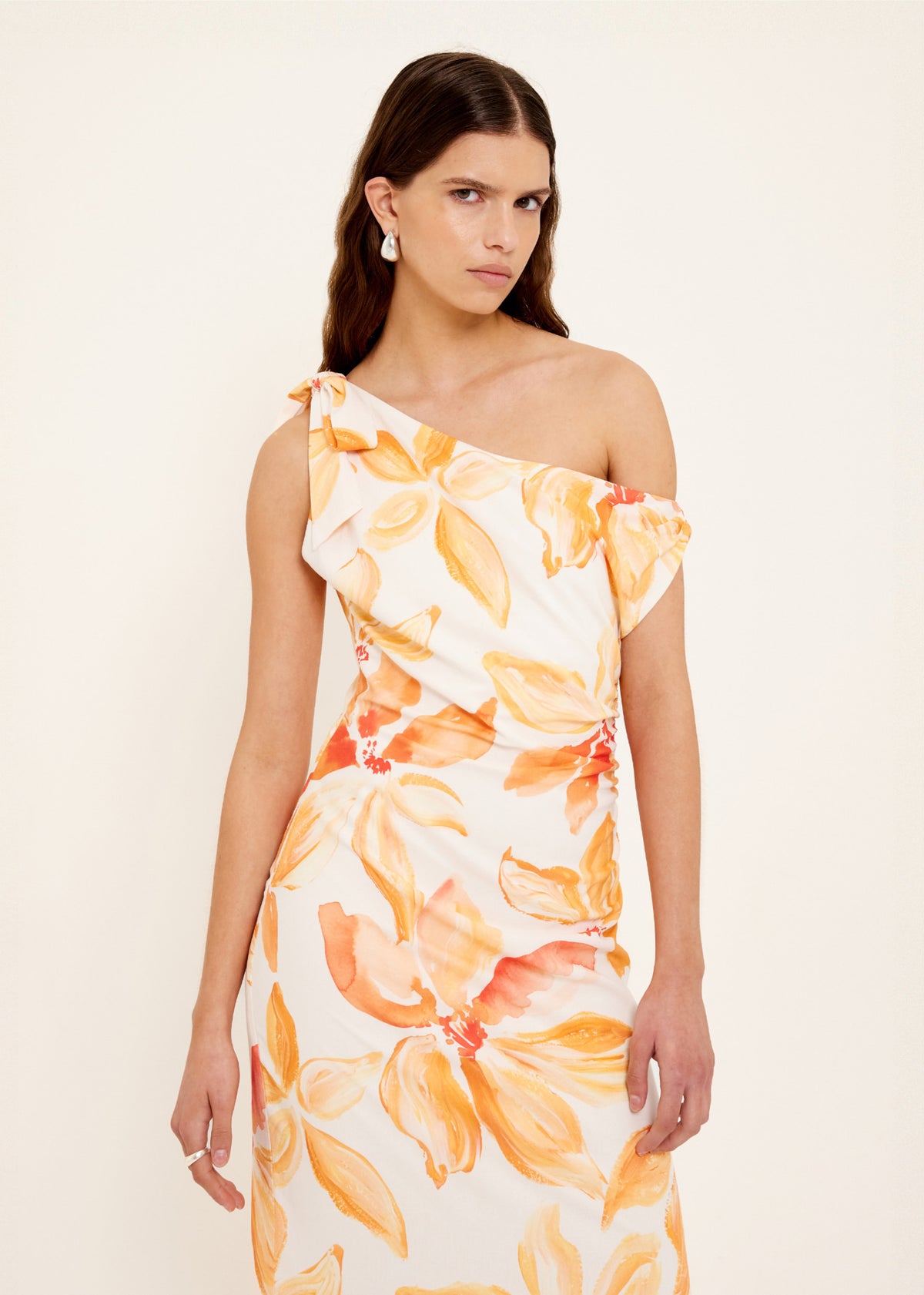 Close-up of the Orange and White Floral Asymmetric Midi Dress, showing a one-shoulder neckline with gathered detail.