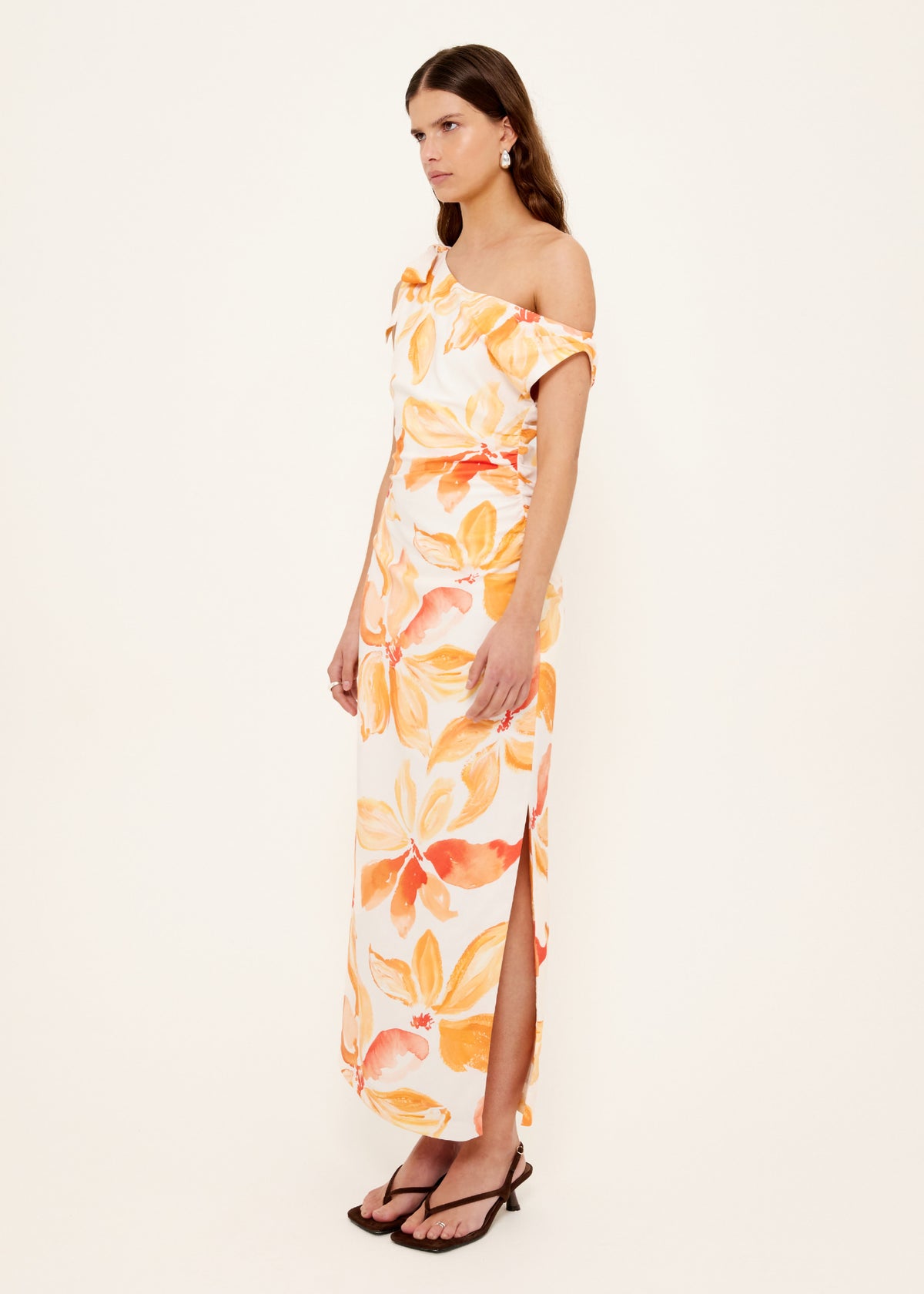 Side view of the Orange and White Floral Asymmetric Midi Dress, showing a one-shoulder neckline with gathered detail.