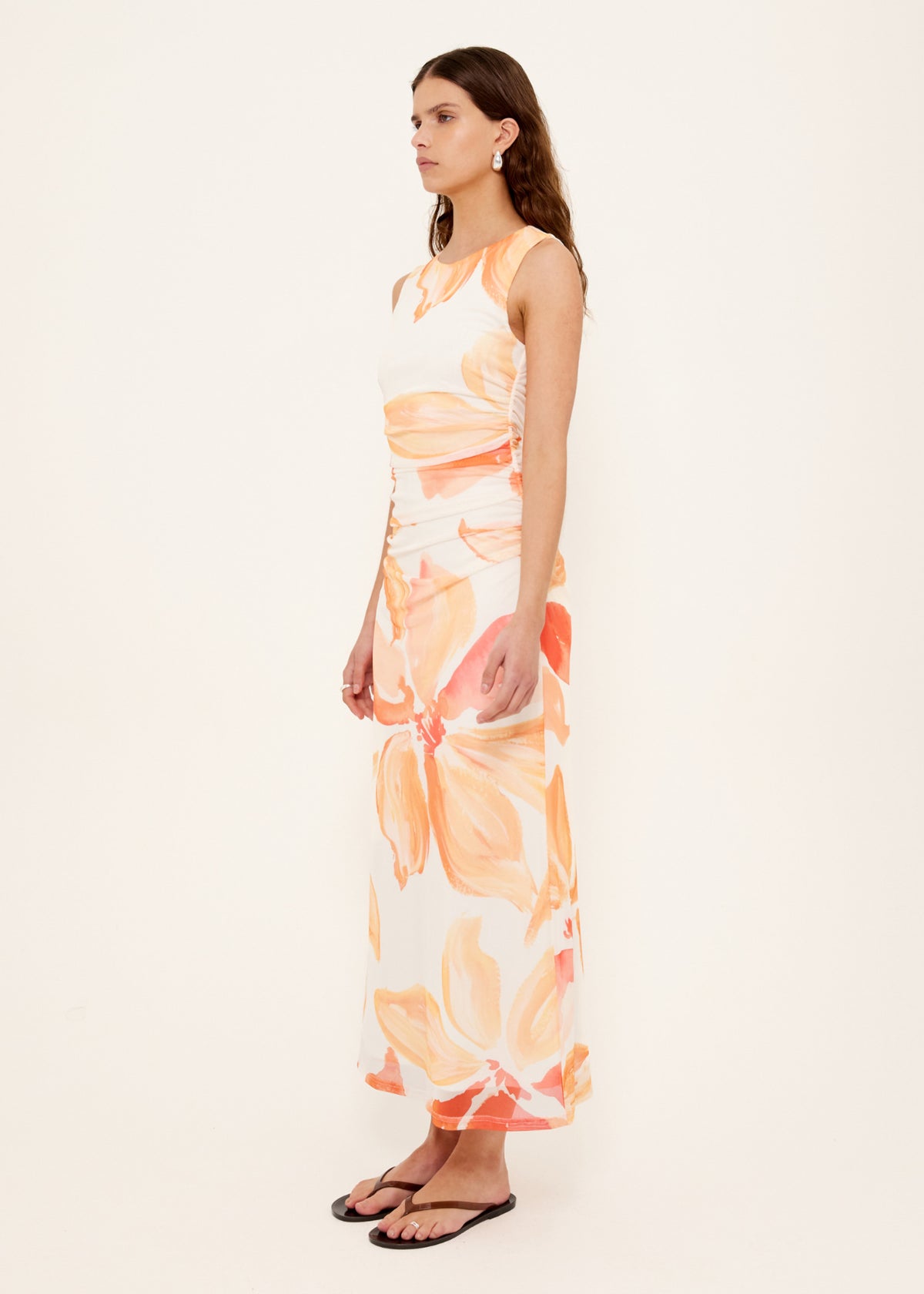 Side view of the Orange and White Floral Mesh Midi Dress, showing abstract floral print in warm peach tones.