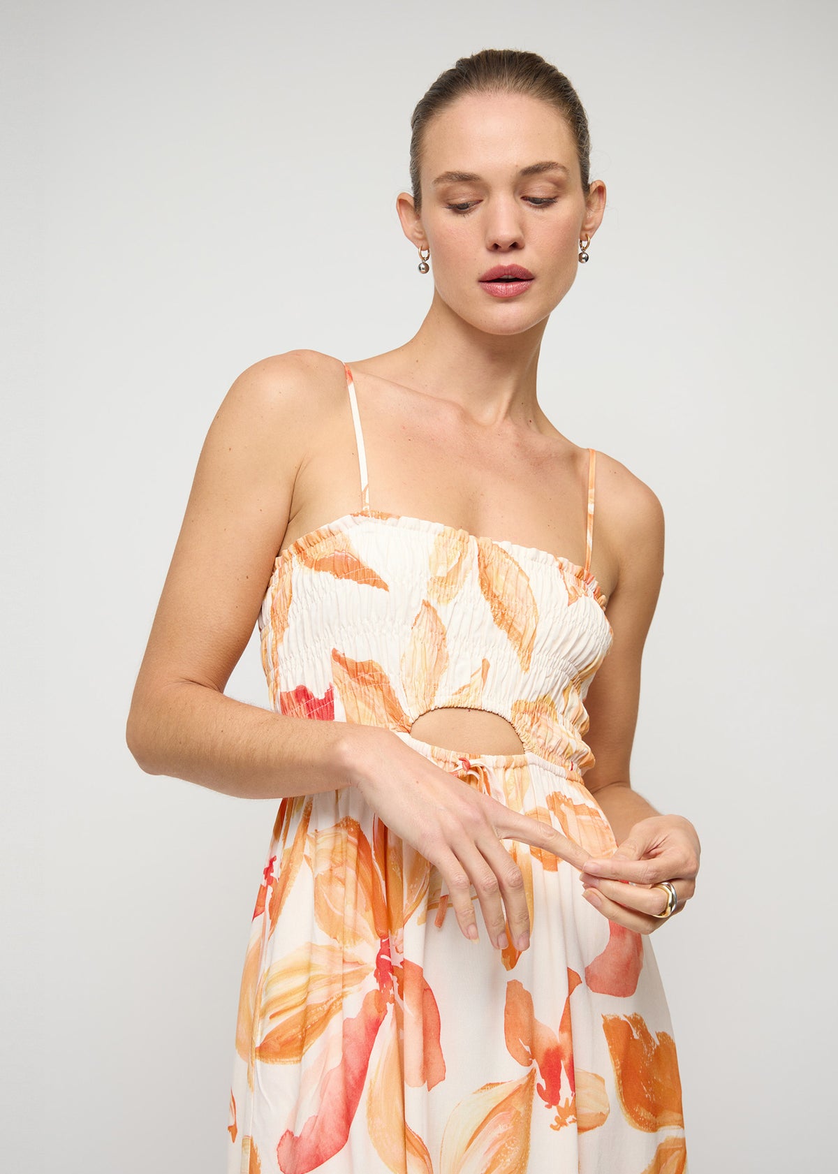 Close-up of the Orange and White Floral Shirred Midi Dress, showing shirred bodice with adjustable straps.