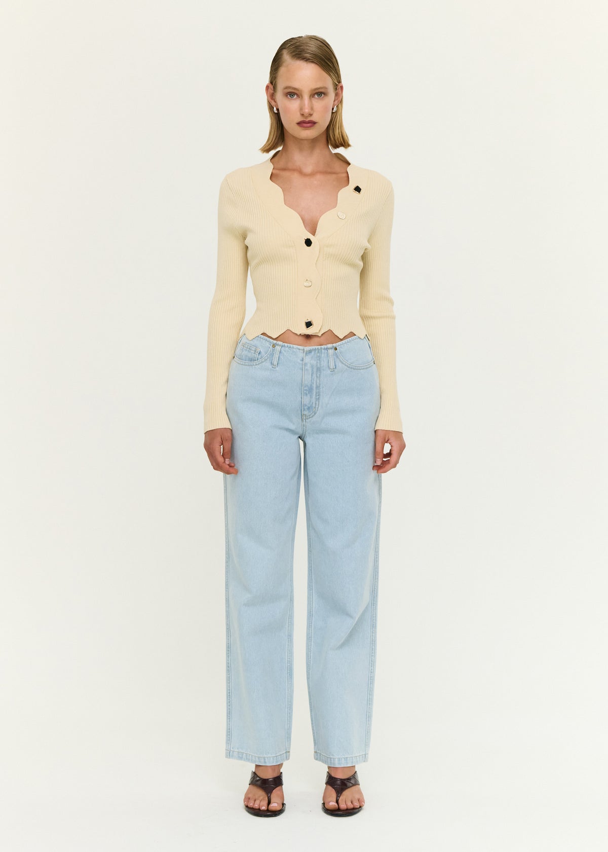 Model wearing Ornate Button Scallop Neck Cardigan in Yellow, showing a fitted silhouette and long sleeves.