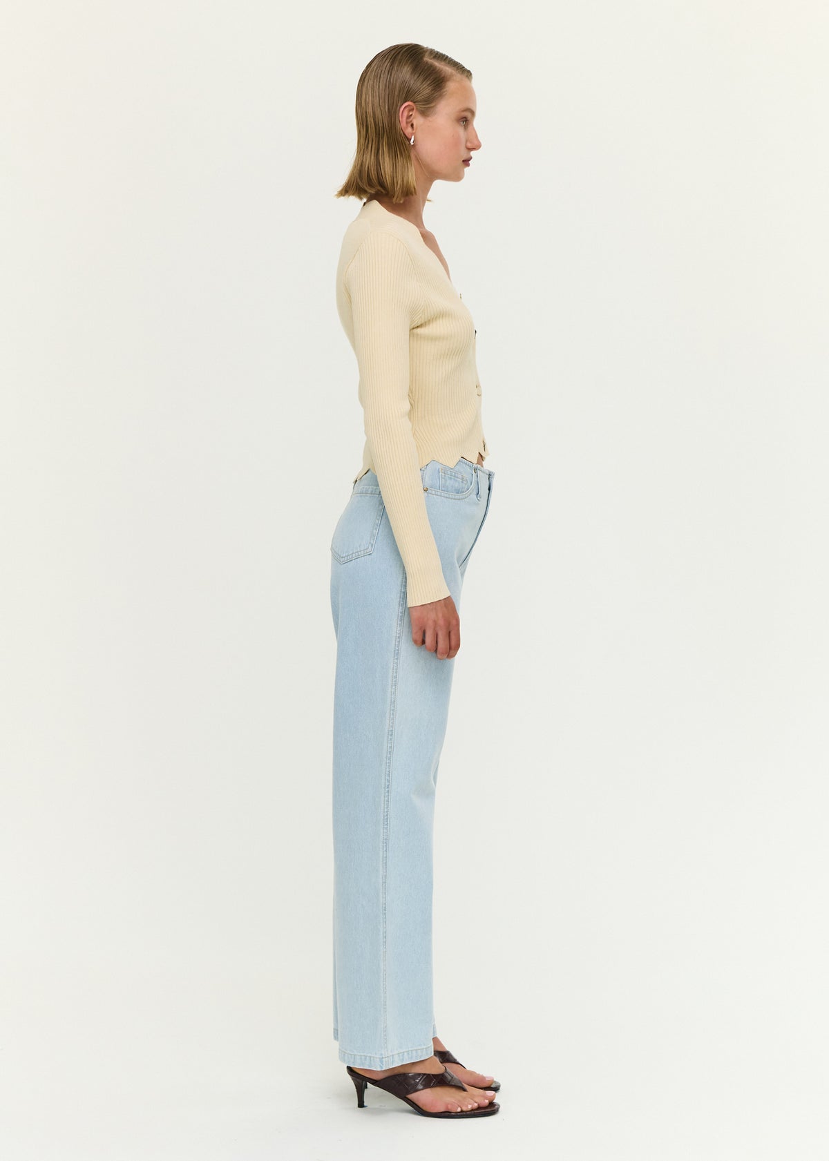 Side view of the Ornate Button Scallop Neck Cardigan in Yellow, showing a scalloped neckline and hem.