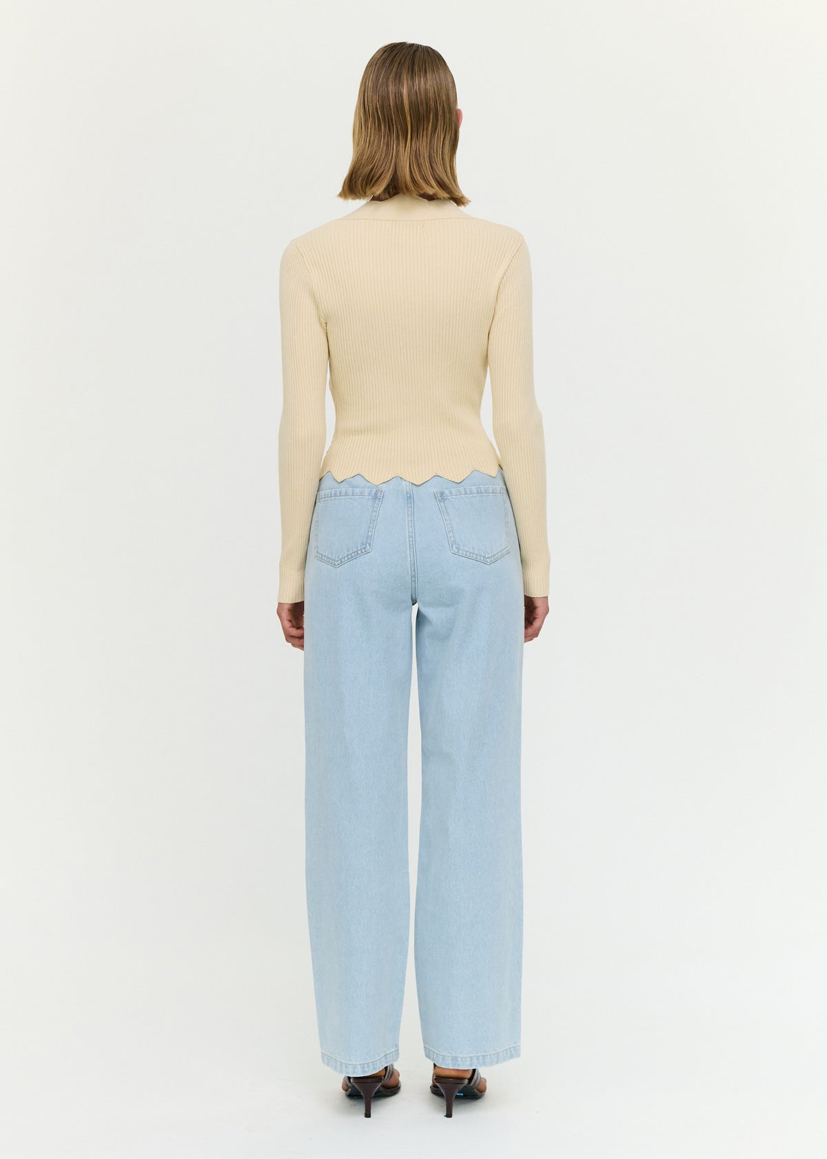 Back view of the Ornate Button Scallop Neck Cardigan in Yellow with a button front closure and a soft ribbed knit fabrication.