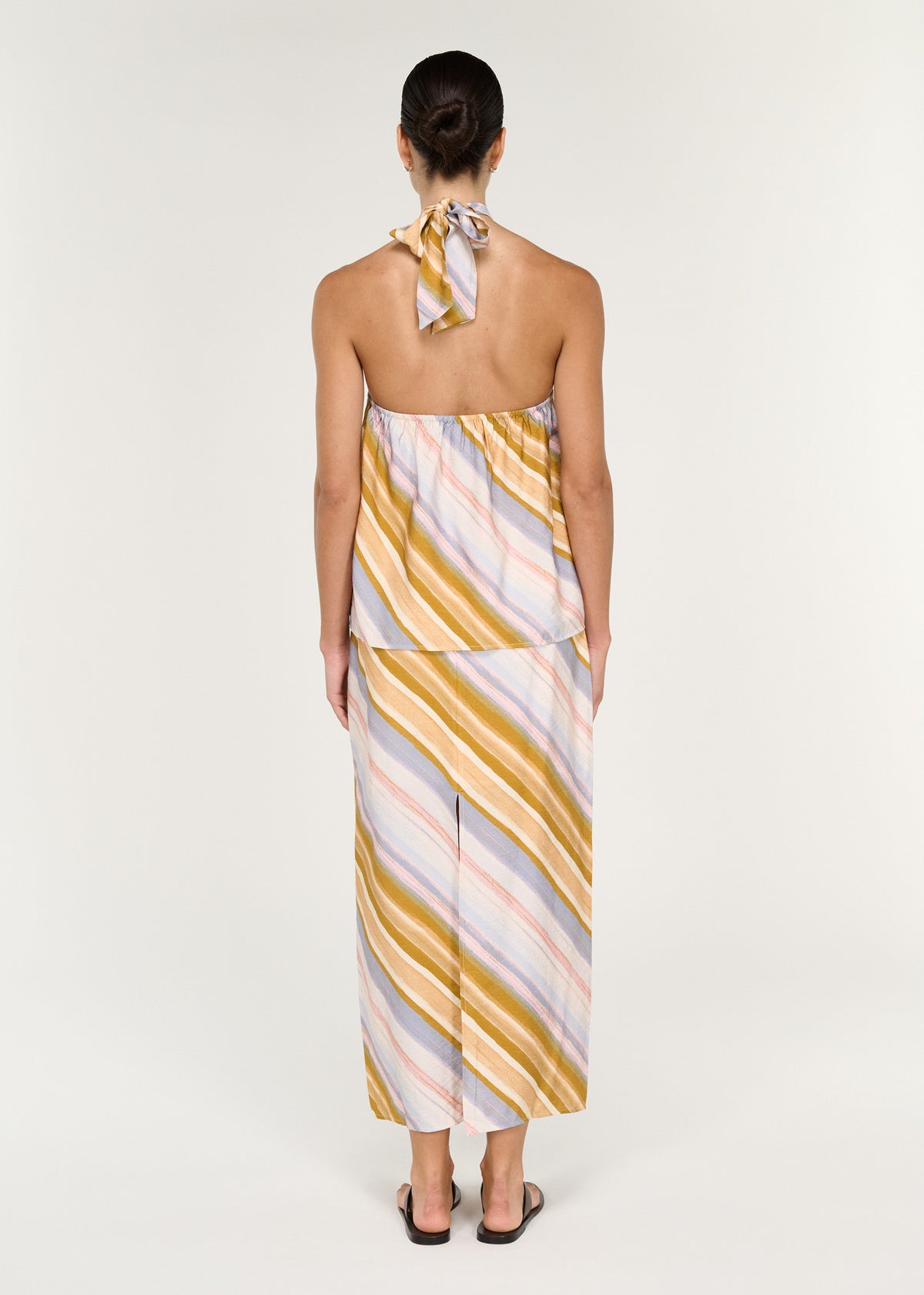 Back view of the Pastel Stripe Twist Detail Halter Top, showing an adjustable tie at back neck and an open back.
