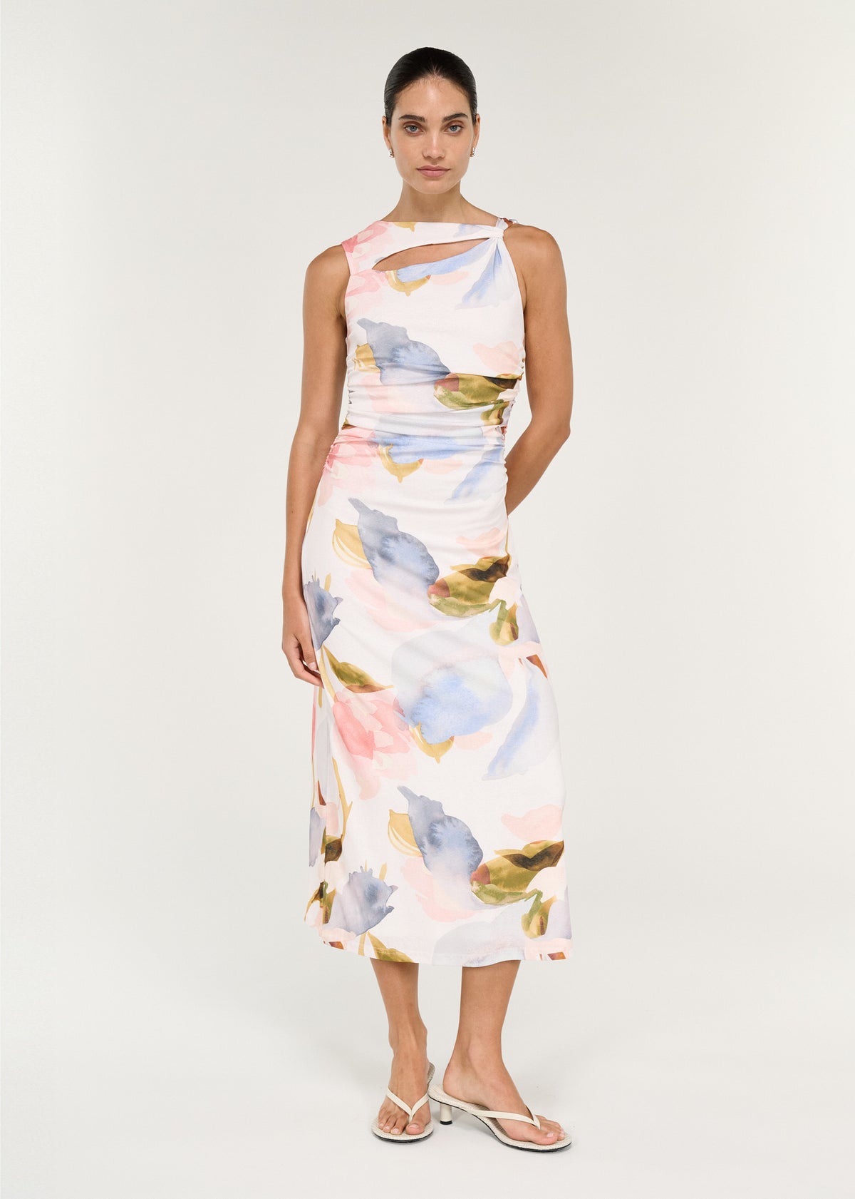 Model wearing Pastel Watercolour Sleeveless Mesh Midi Dress, showing an asymmetric neckline and a front cut-out detail.