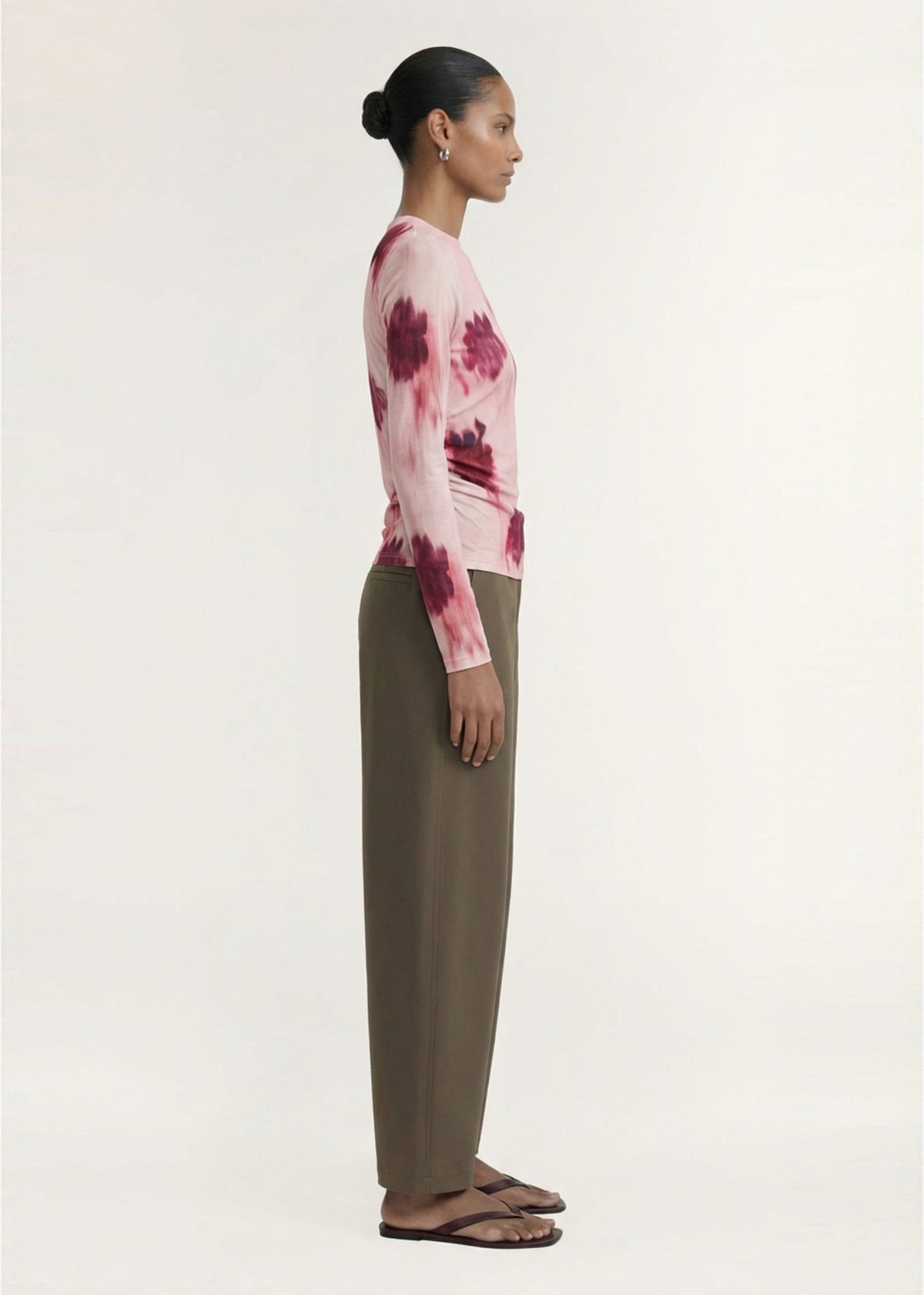 Side profile of the Pink Floral Mesh Long Sleeve Top with a pull-on style and a fully lined body.