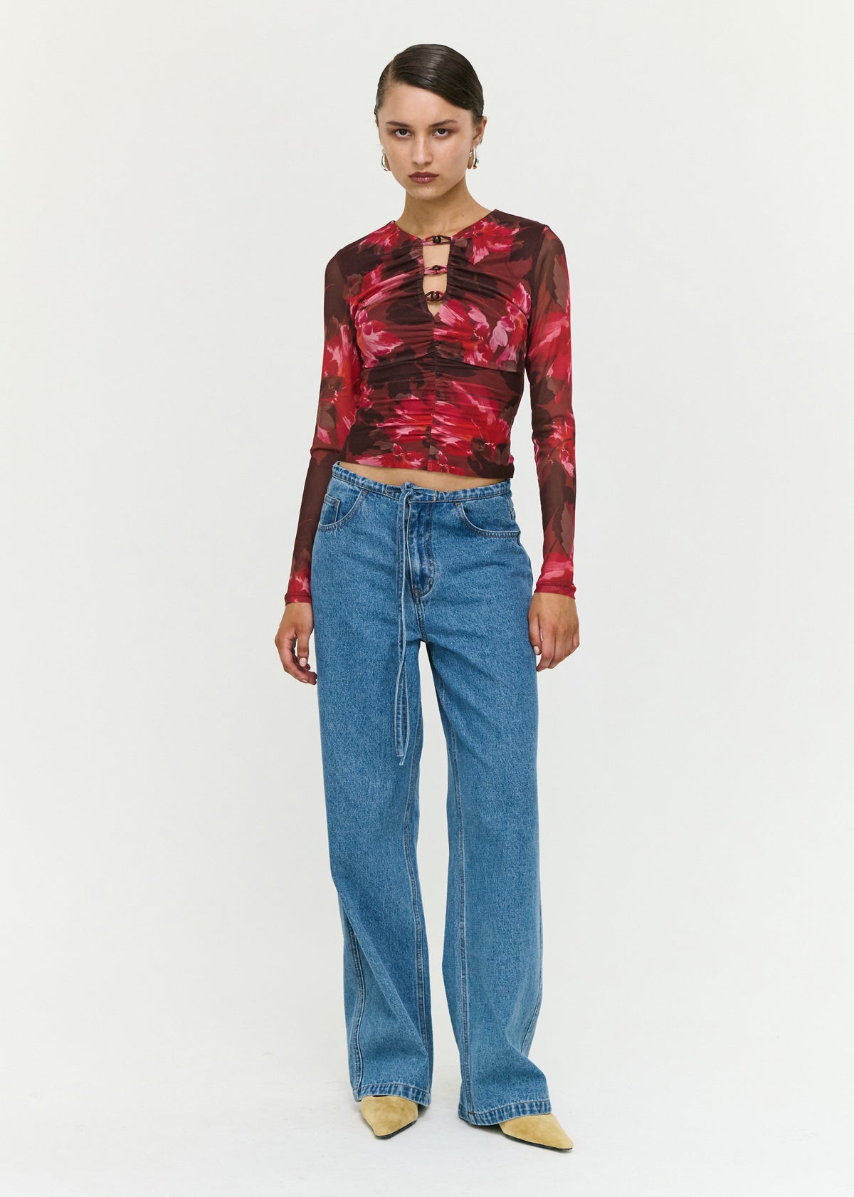 Model wearing Pink Floral Print Mesh Bead Detail Top with a fitted silhouette and a gathered ruched detailing.