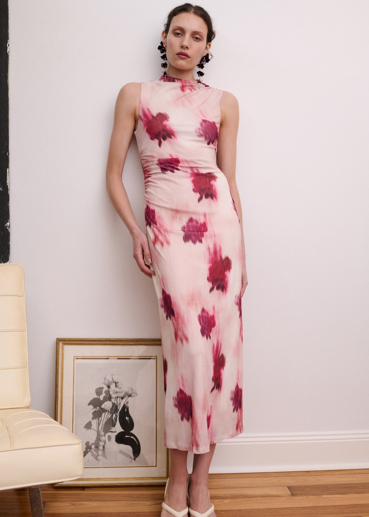 Model wearing Pink Floral Sleeveless Mesh Midi Dress, showing a fitted silhouette and a high neckline.