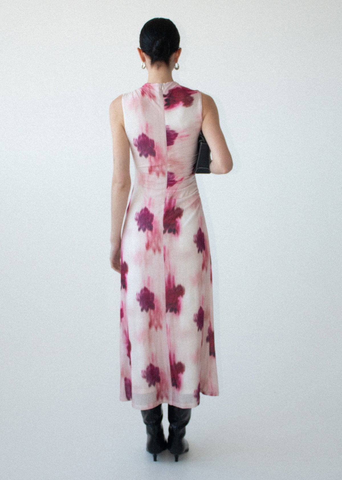 Back view of the Pink Floral Sleeveless Mesh Midi Dress with an invisible back zip closure and a printed mesh fabrication.