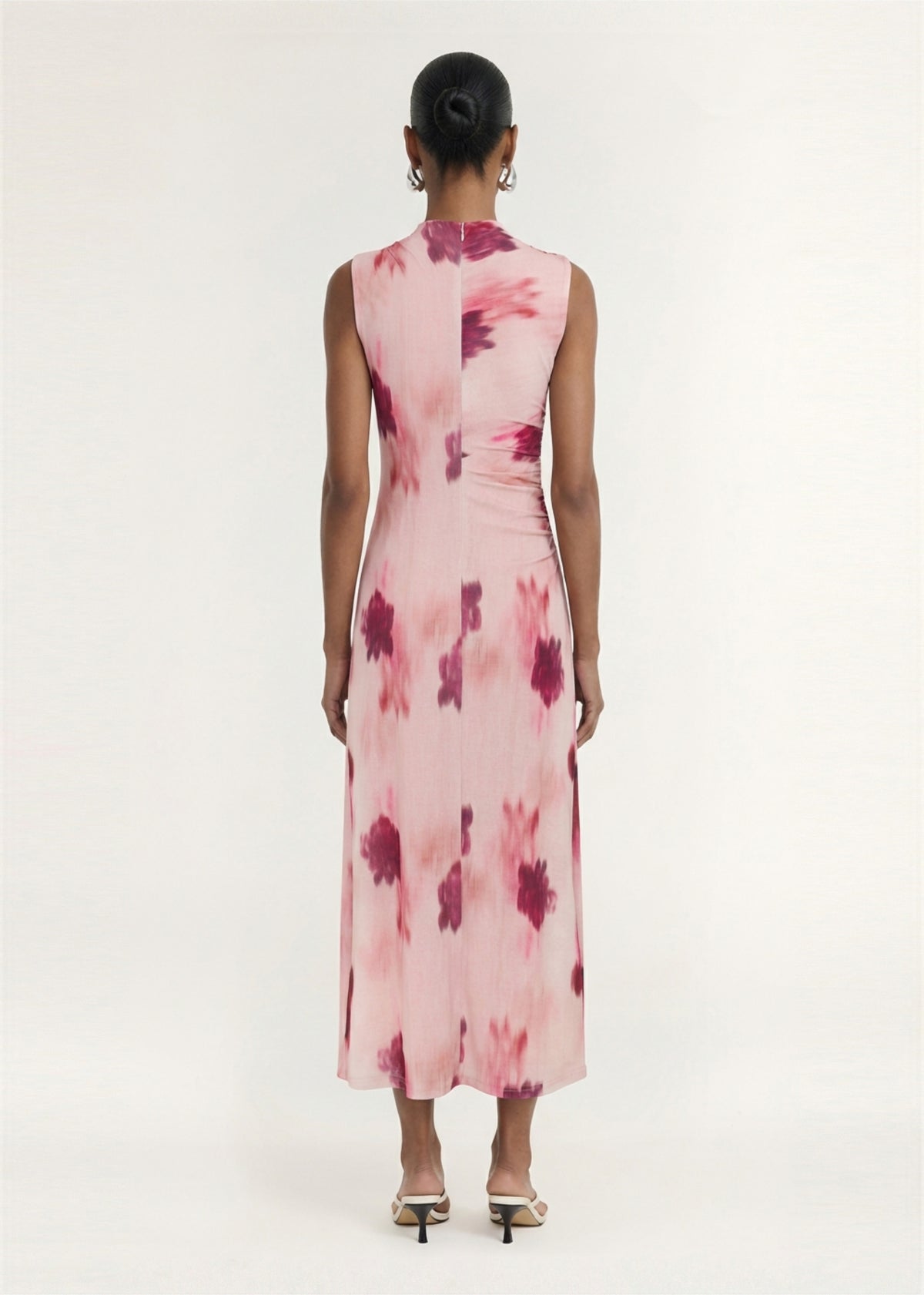 Back view of the Pink Floral Sleeveless Mesh Midi Dress, showing an invisible back zip closure and a printed mesh fabrication.