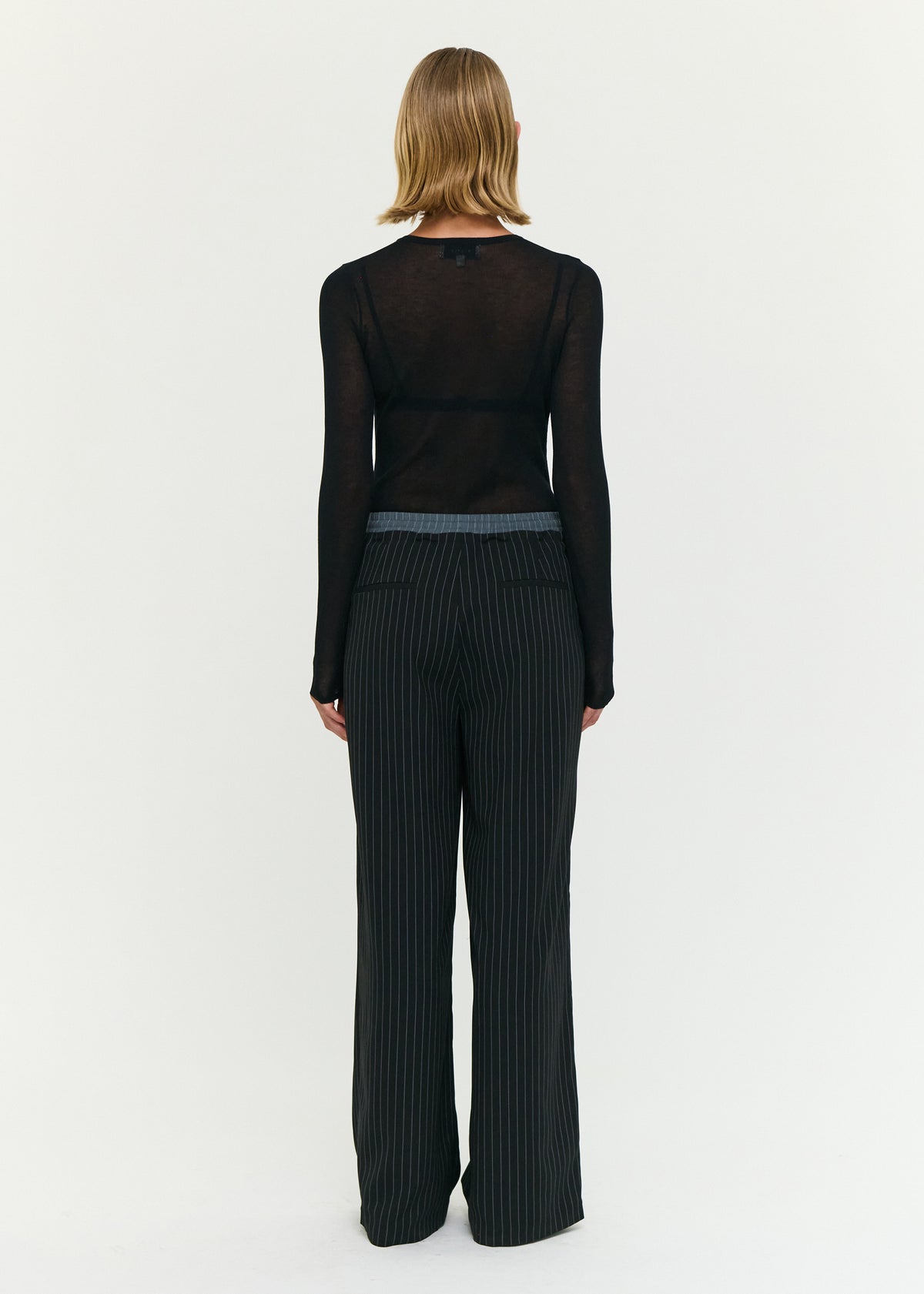 Back view of the Pinstripe Relaxed Drawstring Pants, showing an adjustable drawcord tie and a soft woven fabrication.