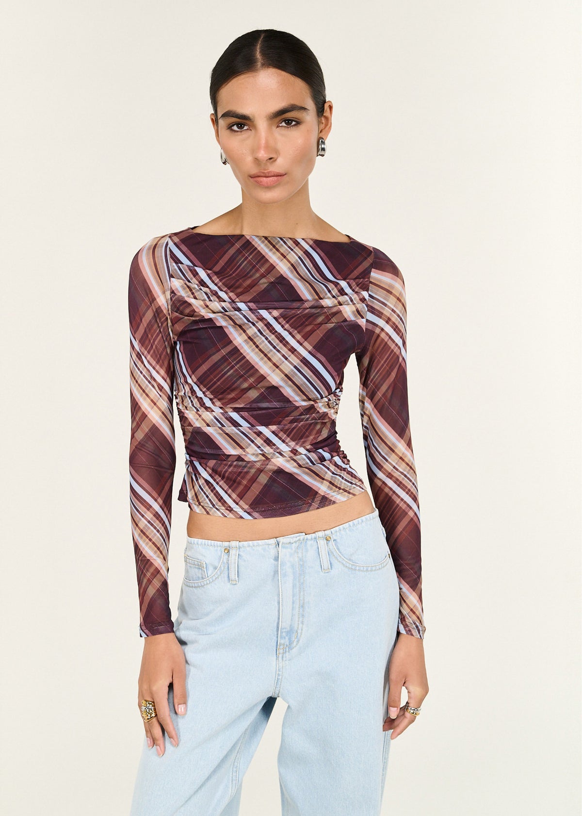 Close-up of the Plaid Mesh Boat Neck Top with Gather Detail, showing a boat neckline and a ruched detailing through bodice.