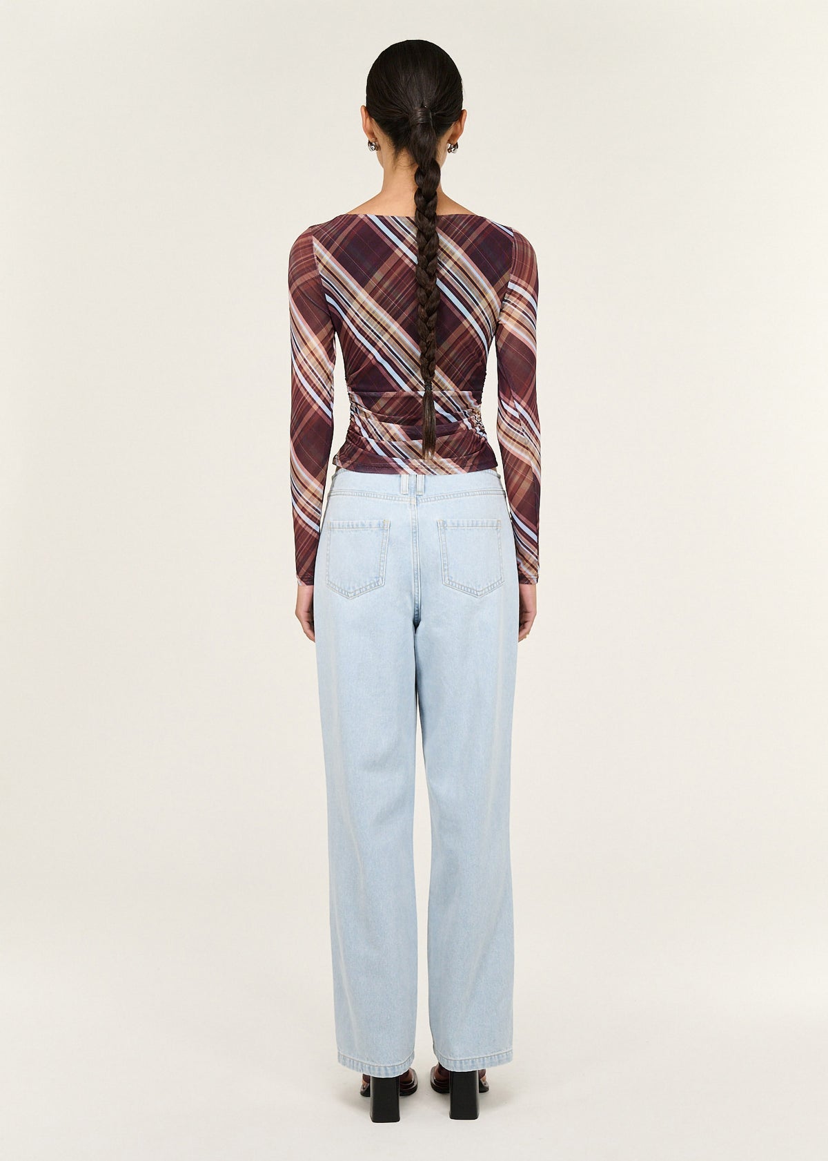 Back view of the Plaid Mesh Boat Neck Top with Gather Detail with a sheer mesh fabrication and a boat neckline.