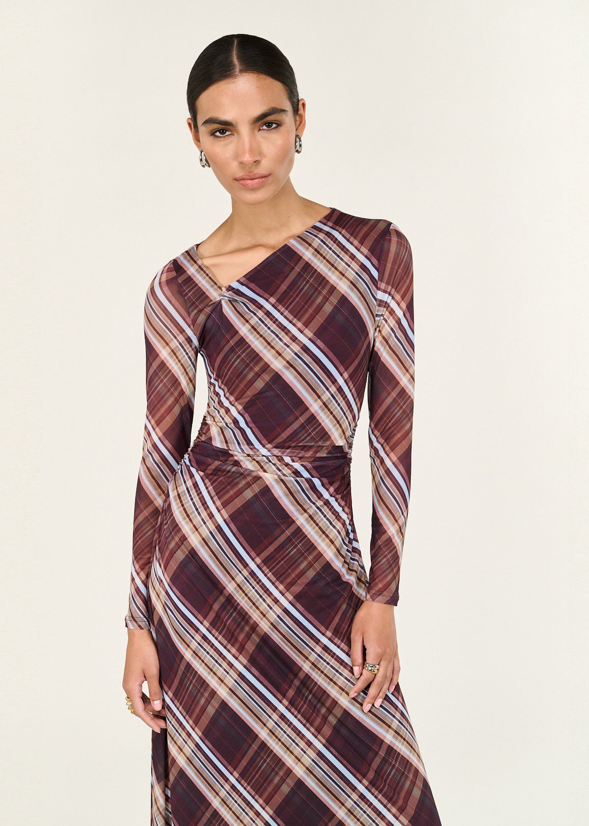 Close-up of the Plaid Mesh Long Sleeve Midi Dress, showing long sleeves and an asymmetric neckline detail.