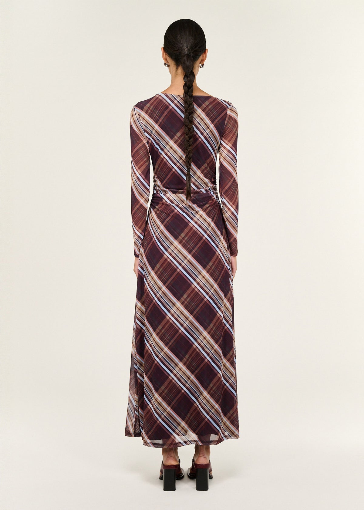 Back view of the Plaid Mesh Long Sleeve Midi Dress with long sleeves and an asymmetric neckline detail.