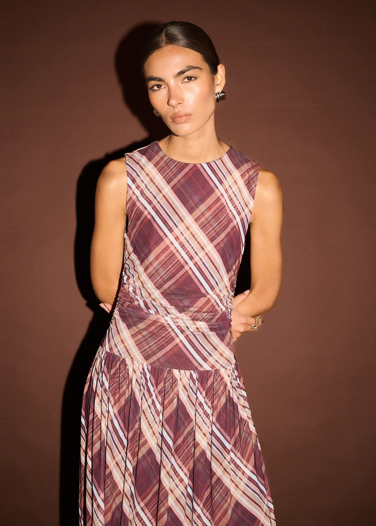 Close-up of the Plaid Mesh Midi Dress with Drop Waist, showing a sleeveless cut and a fitted bodice with drop waist seam.