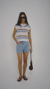 Model wearing a Striped Knit Tank Top paired with denim shorts and accessories.