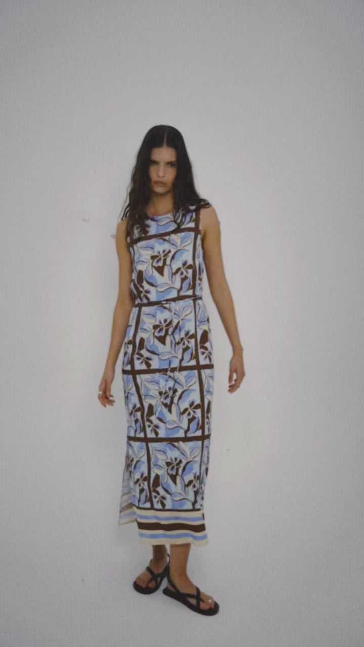 Blue Abstract floral Midi Dress with Tie Waist model wearing the dress against a plain background.