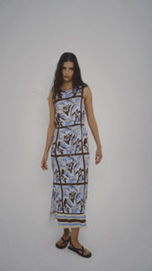 Blue Abstract floral Midi Dress with Tie Waist model wearing the dress against a plain background.