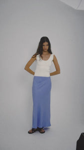 Model wearing Jacaranda Tencel Linen Blend Maxi Skirt in cobalt blue with a casual white top.