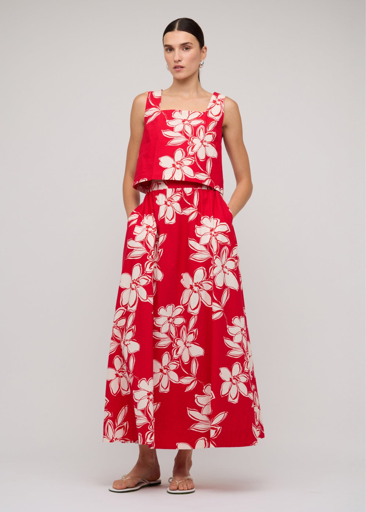Model wearing Red and White Cotton Floral Crop Top, showing a cropped length and a sleeveless cut.