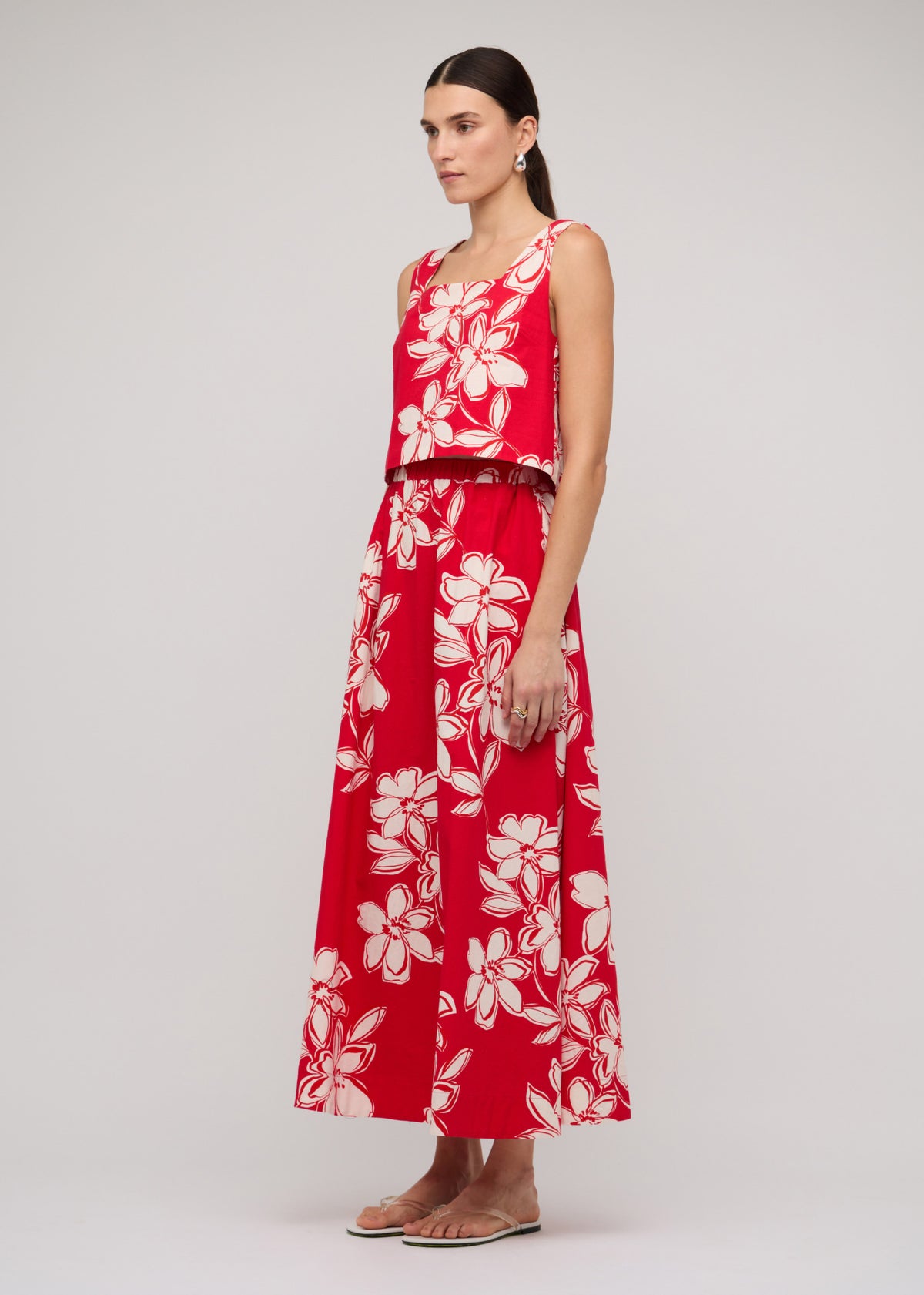 Side view of the Red and White Cotton Floral Crop Top, showing a cropped length and a sleeveless cut.