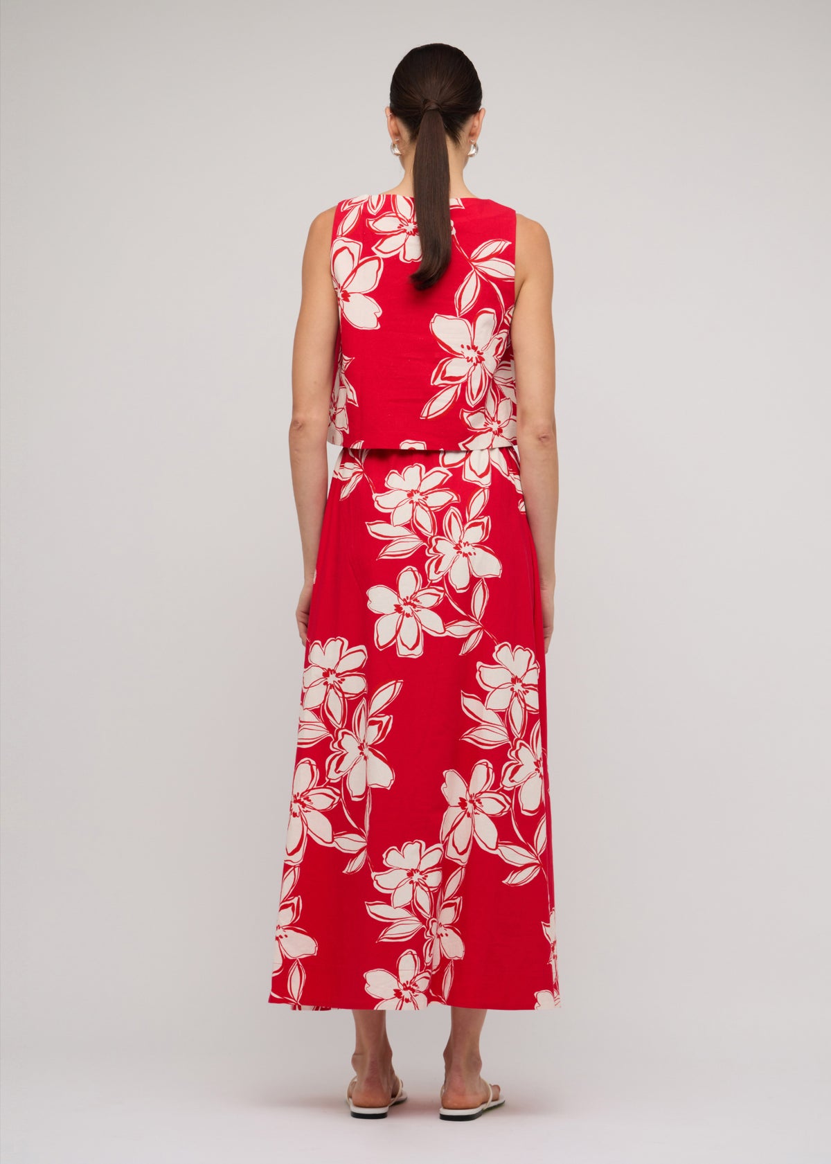 Back view of the Red and White Cotton Floral Crop Top with a red with white floral print and a square neckline.